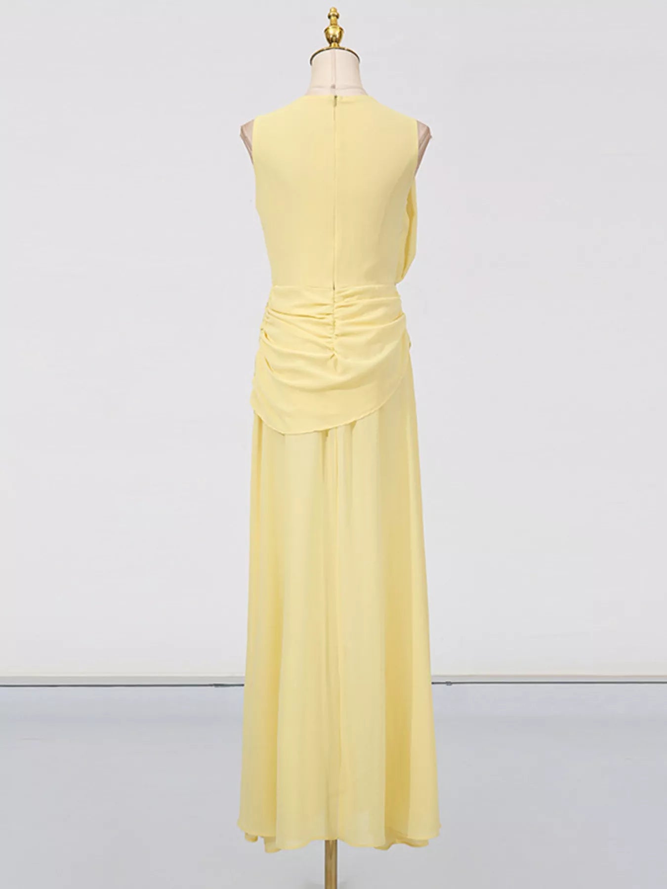 Yellow sleeveless ruched high-slit maxi dress from Trendsi, flowing fabric with a fitted bodice and dramatic slit.