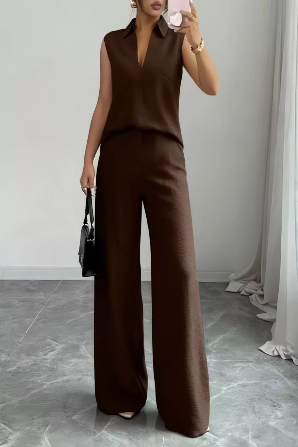 V-neck sleeveless top with wide-leg pants set by Trendsi, featuring a stylish, comfortable fit and modern design.