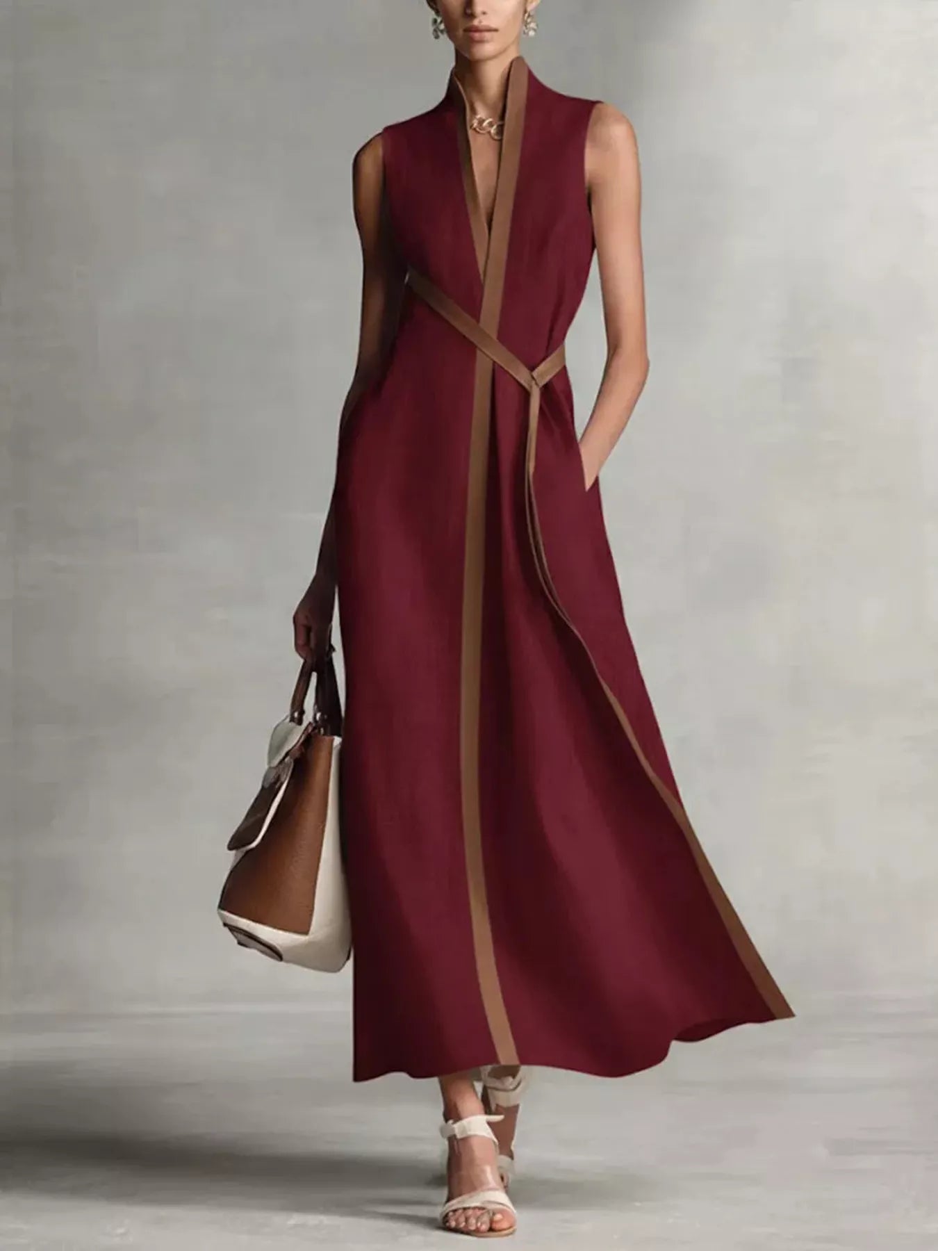 Sleeveless maxi dress with contrast trim from Trendsi, featuring a flowing design and elegant style.