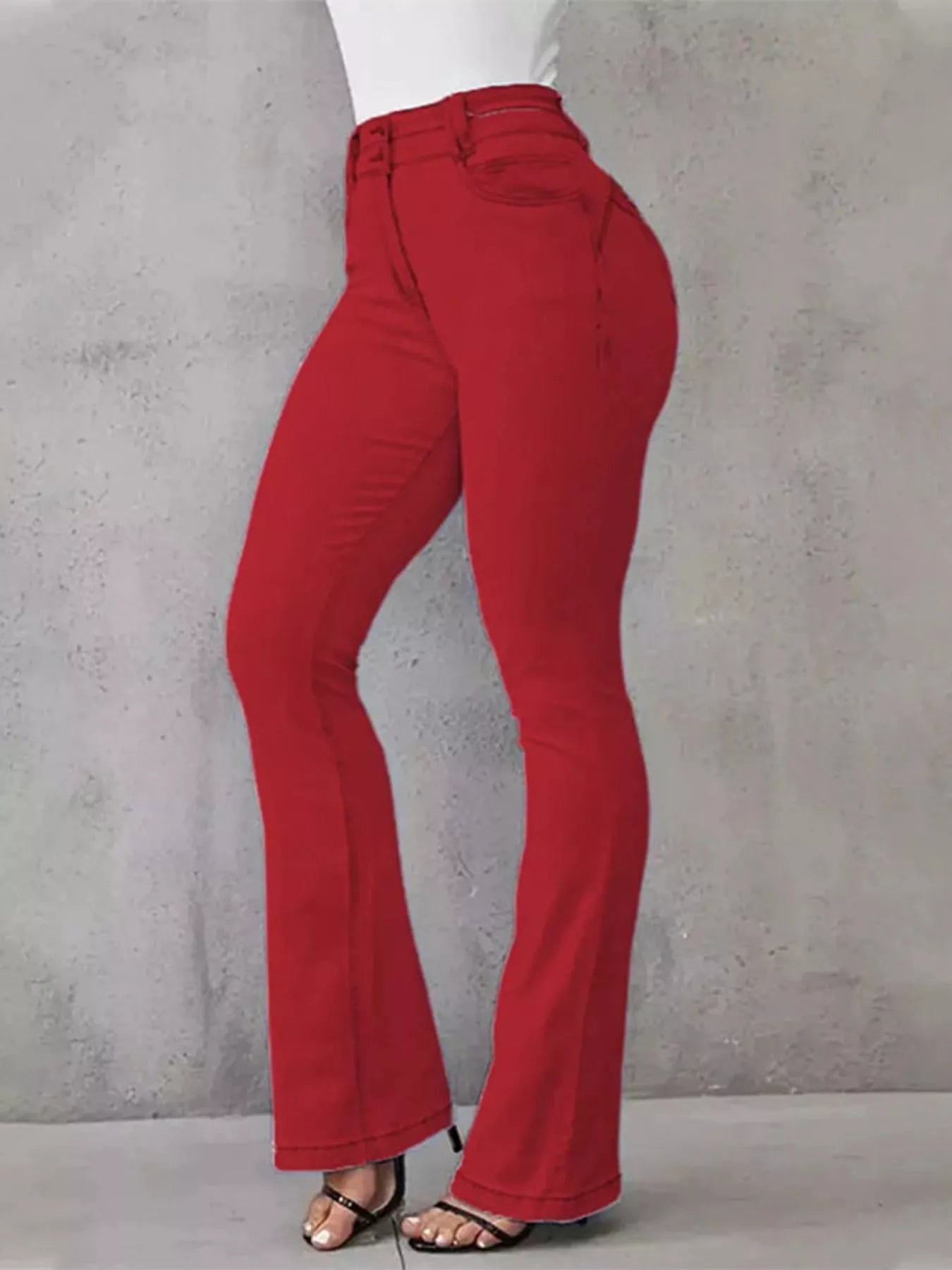 High-waisted flare jeans by Trendsi, stylish denim bottoms with a fitted waist and wide flare legs, shown on a model.