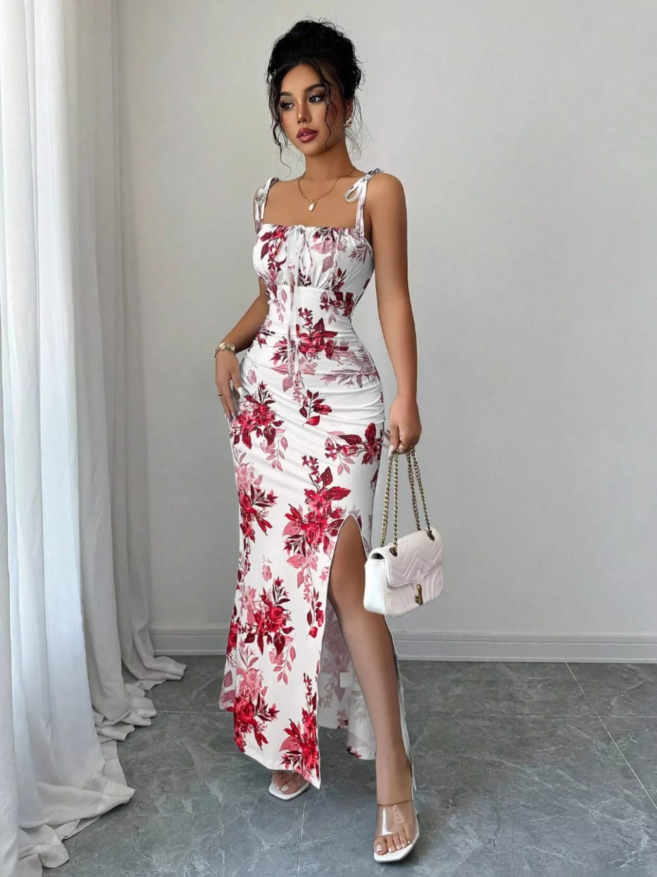 Printed tie strap slit maxi dress from Trendsi featuring a flowing design, adjustable straps, and a high slit for a stylish look.