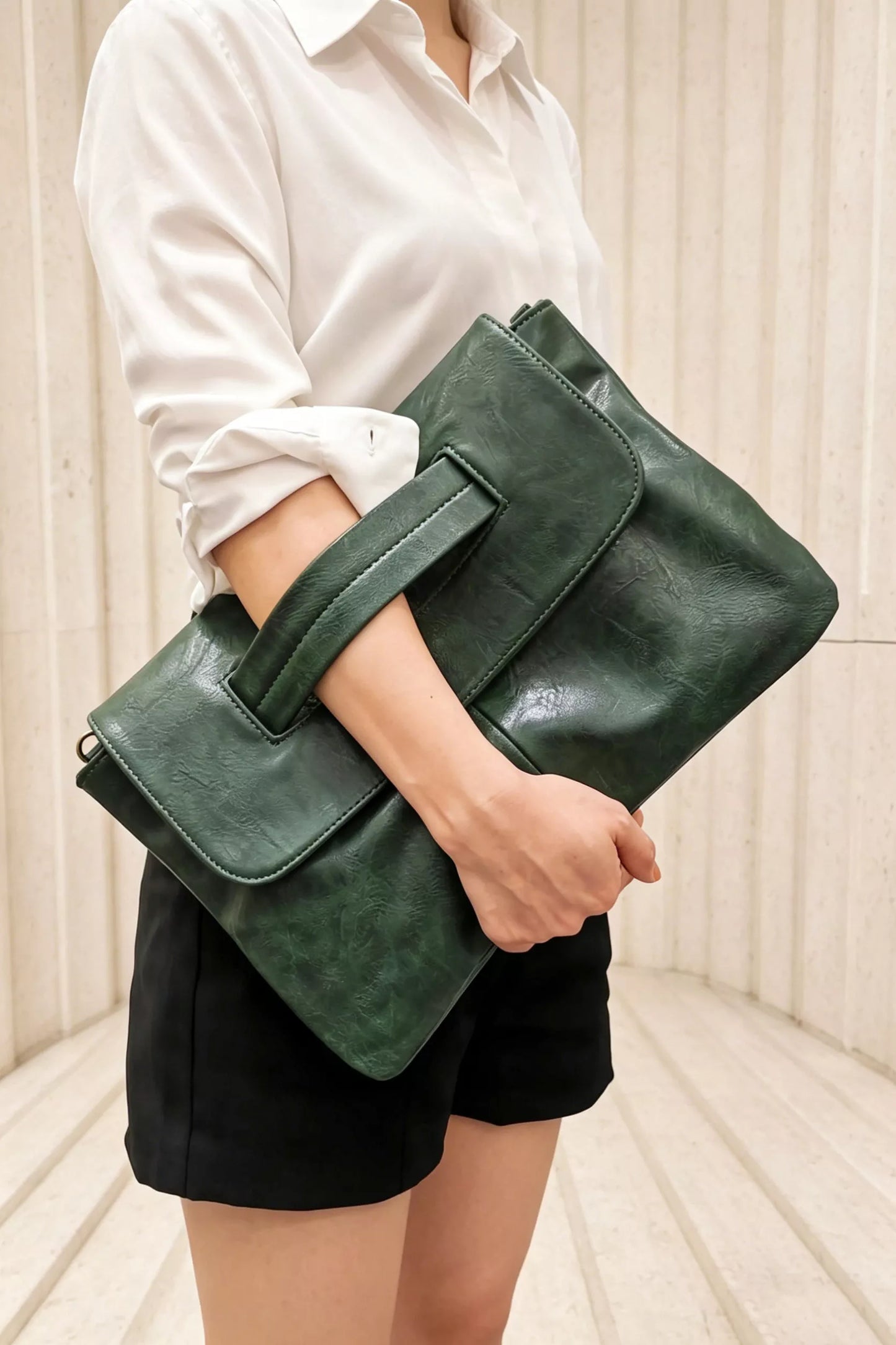Vintage style envelope clutch handbag by Trendsi, featuring a sleek design with a flap closure and elegant craftsmanship.