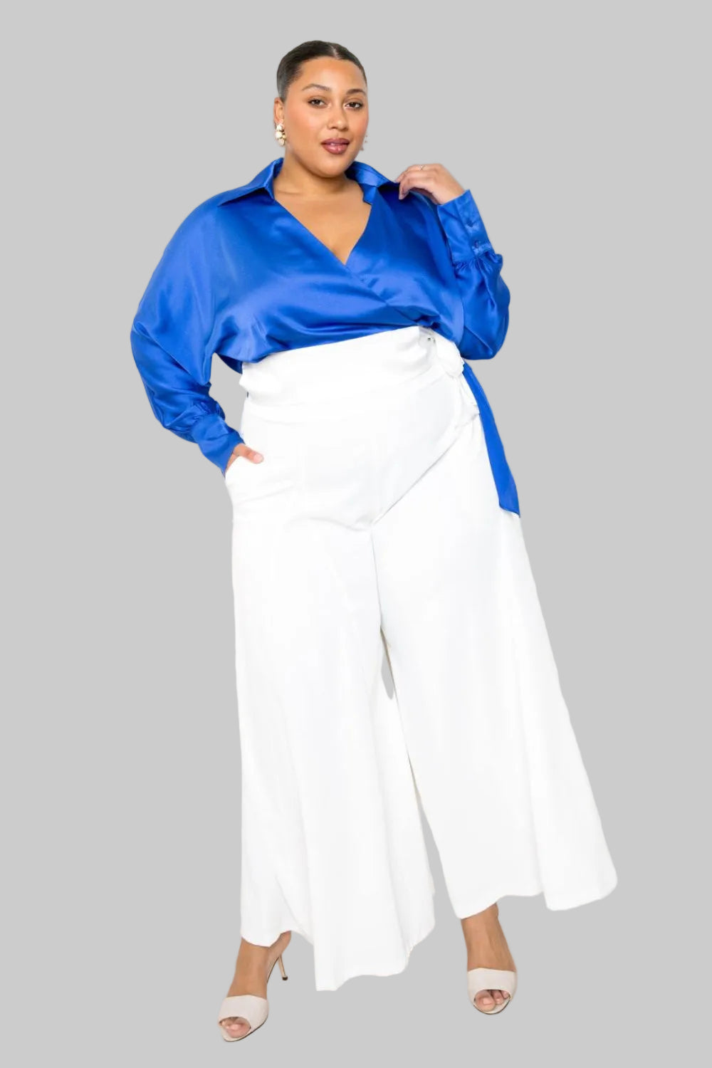 White Palazzo Pants from Toshe Women's Fashions, featuring flowy fabric and wide-leg design, shown on a model.