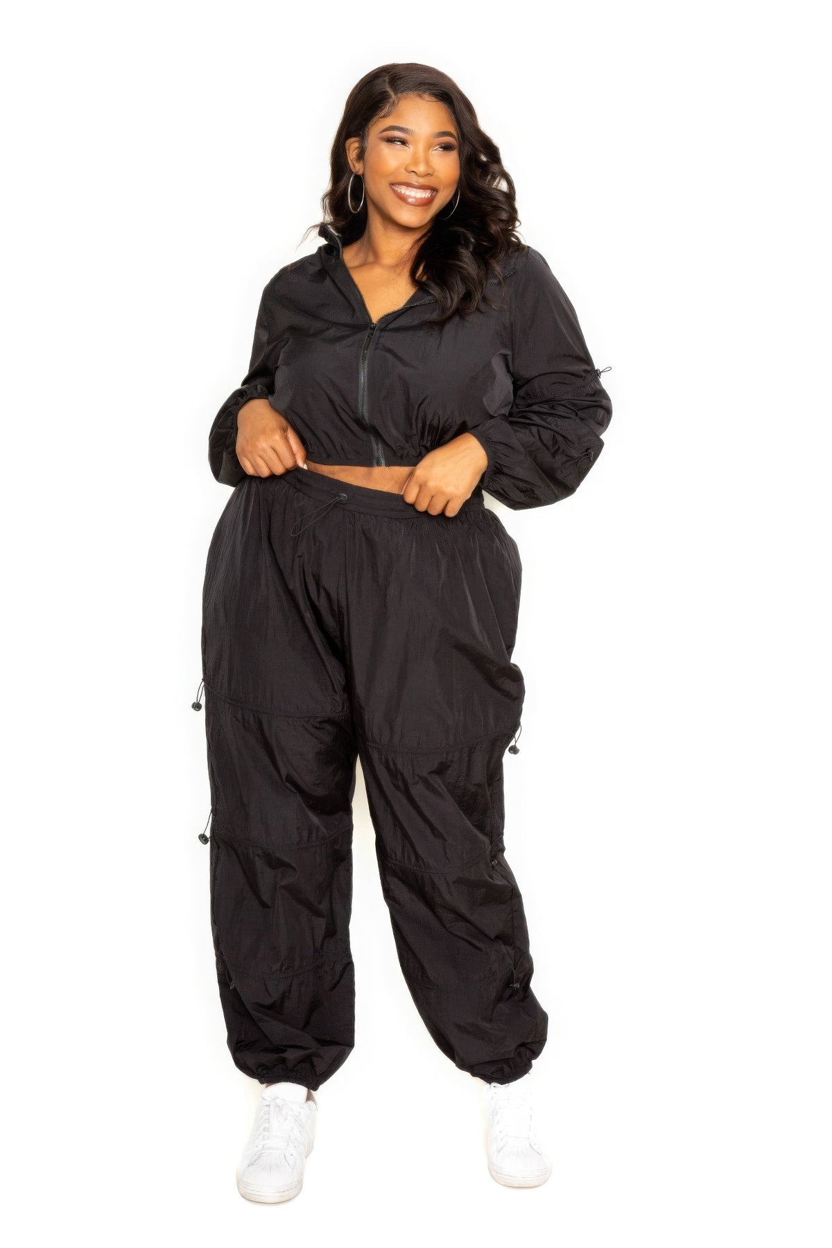 Toshe women's cropped zip-up top and pants set with cord lock detail, casual athleisure outfit, charcoal gray fabric.