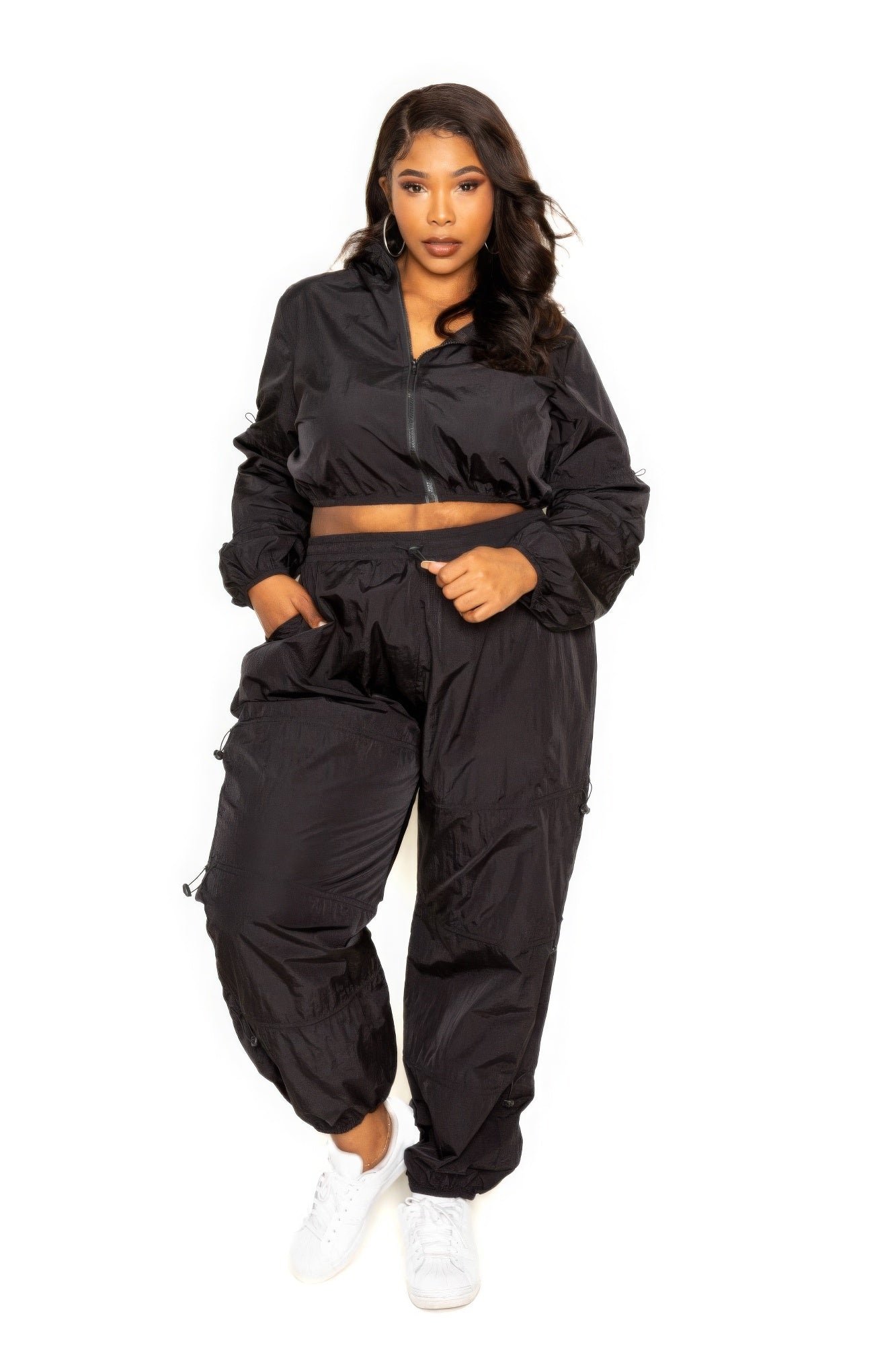 Toshe Women's Fashions cropped zip-up top and pants set with cord lock details, casual and trendy activewear outfit.