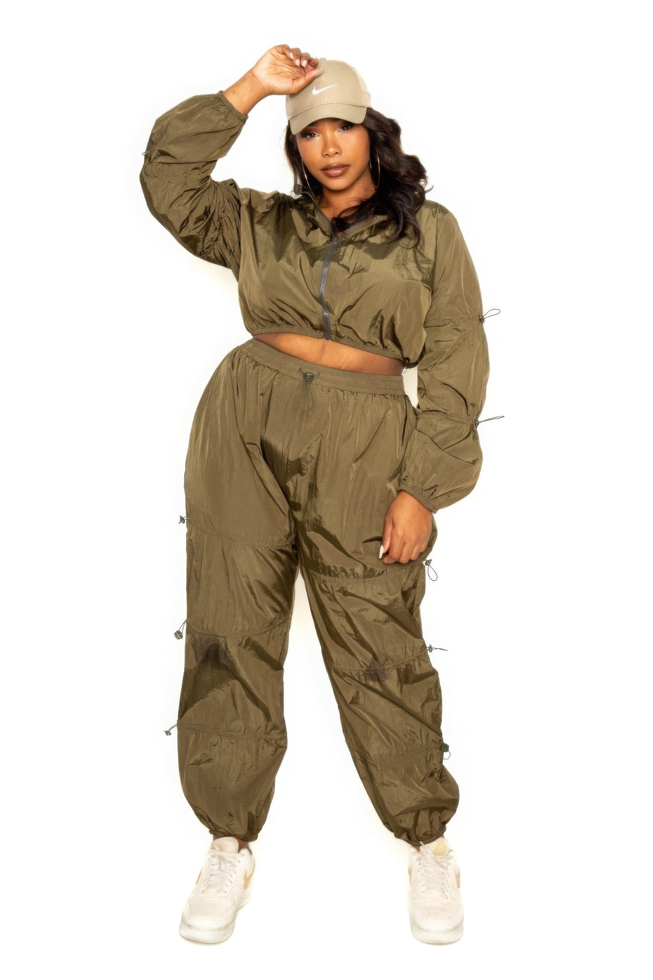 Toshe women's cropped zip-up top and pants set with cord lock detail, casual loungewear ensemble in soft fabric.