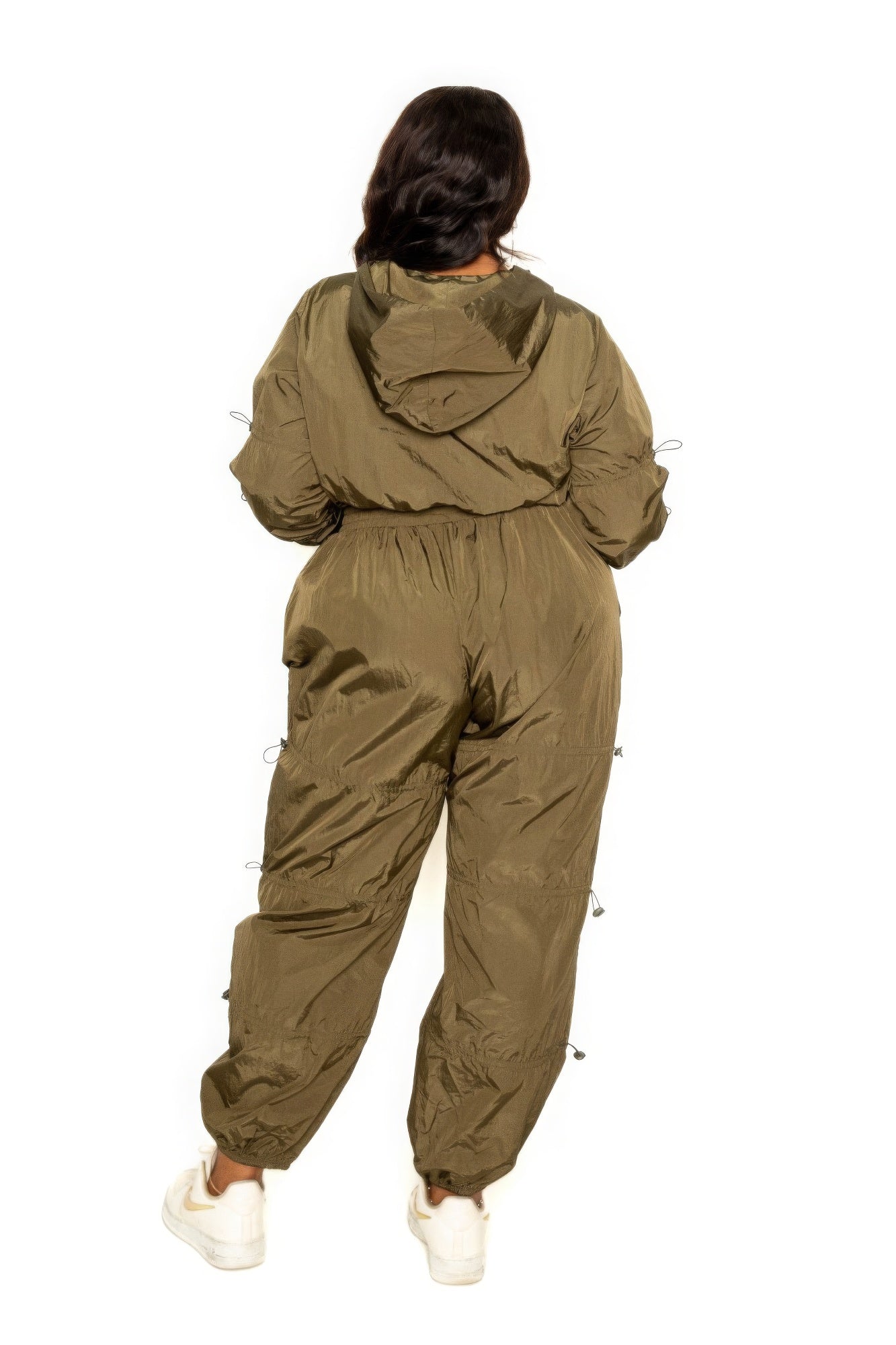 Toshe women's cropped zip-up top and pants set with cord lock detail, casual loungewear or athleisure outfit.