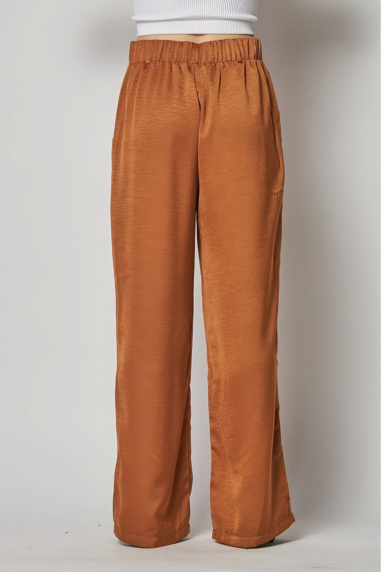 Satin cargo pocket wide-leg pants in a sleek finish, featuring large front pockets and a relaxed fit, by Toshe Women's Fashions.