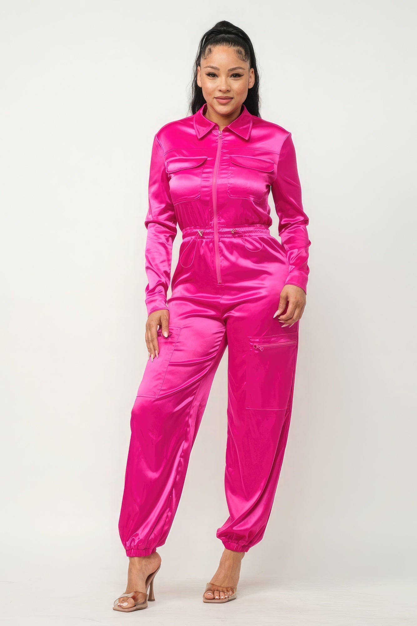 Fuschia zipper pocketed jumpsuit by Toshe Women's Fashions, featuring front pockets, fitted waist, and sleeveless design.