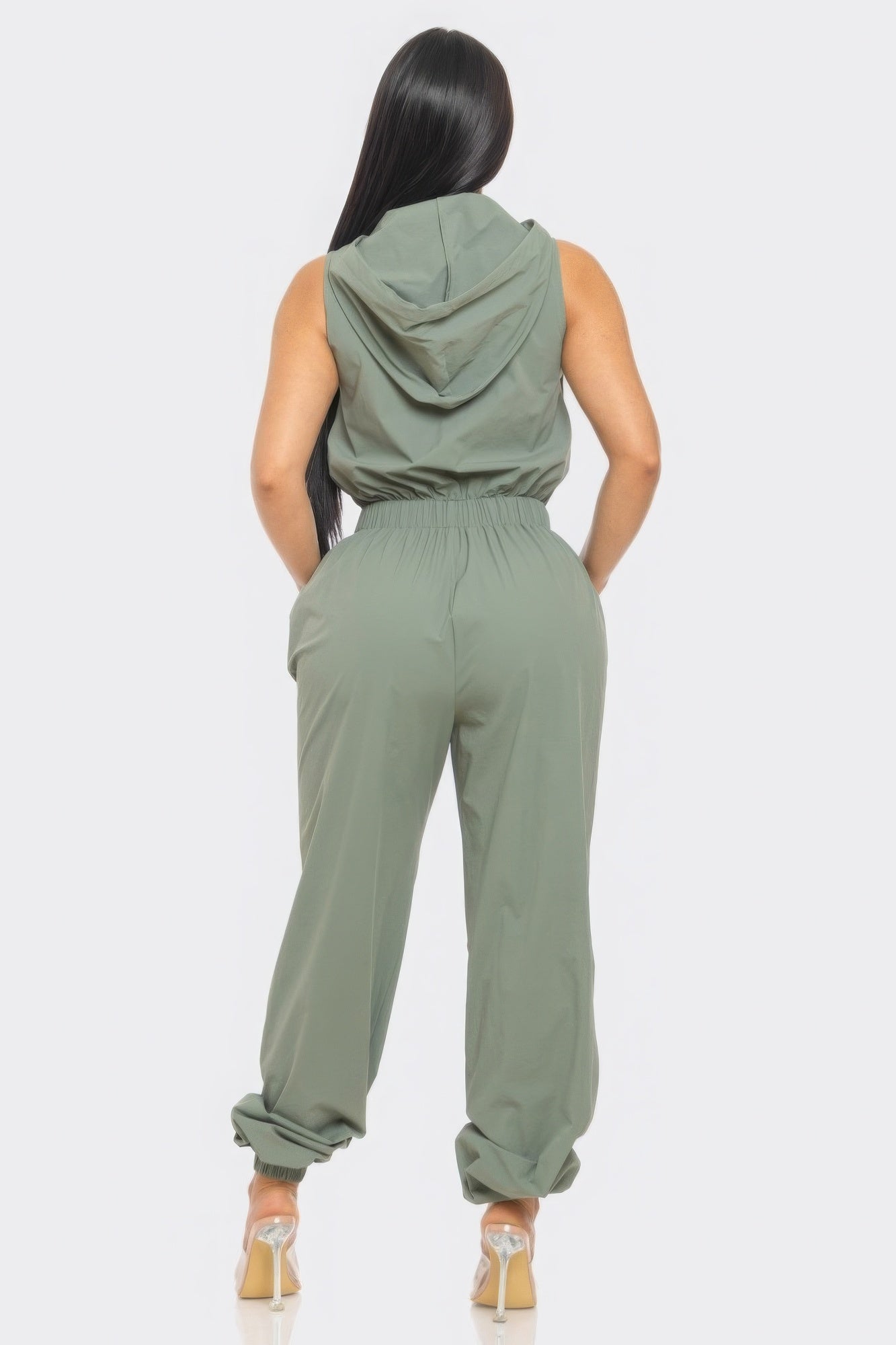Women’s beige cargo jumpsuit by Toshe Women's Fashions, featuring utility pockets and a relaxed fit.