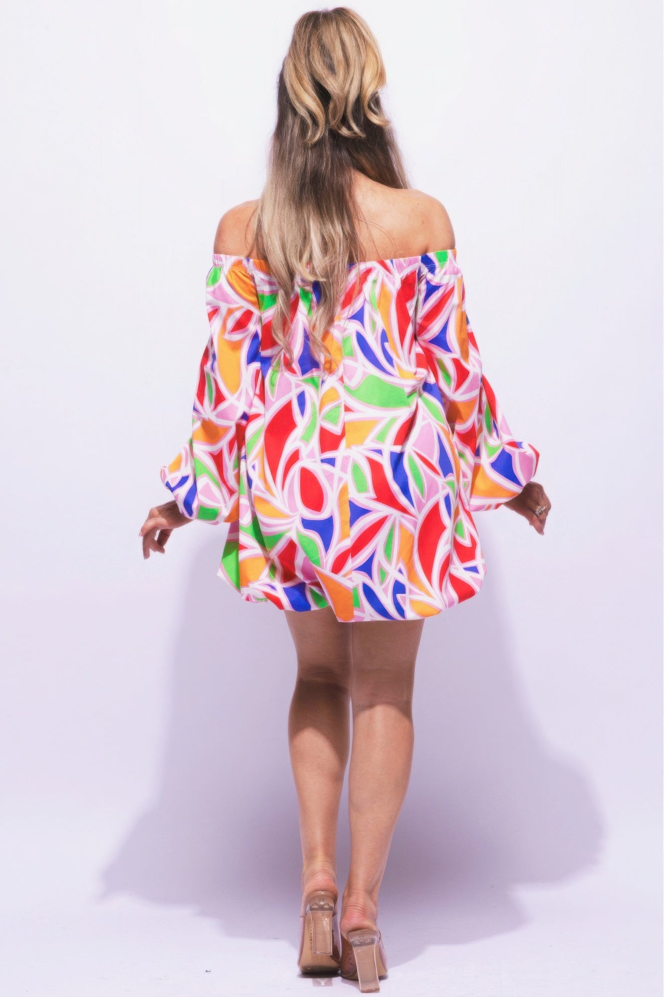 Off shoulder bubble dress by Toshe Women's Fashions, featuring a fitted bodice and voluminous skirt, in soft pastel color.