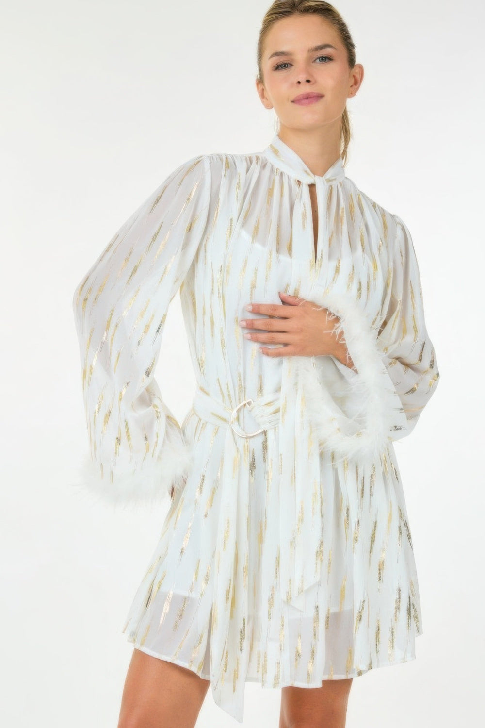 Metallic sheer mini dress by Toshe Women's Fashions featuring a shimmering, lightweight fabric and trendy design.