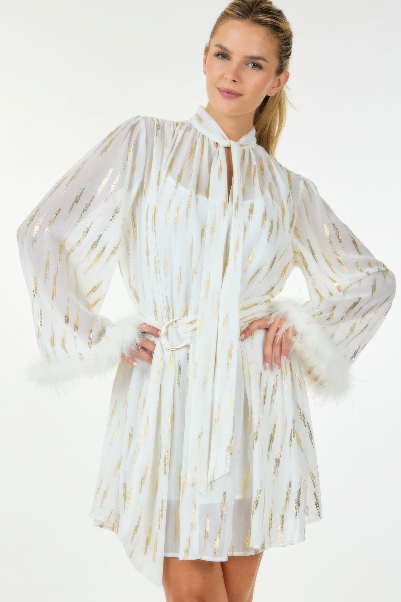 Metallic sheer mini dress by Toshe Women's Fashions featuring shiny, see-through fabric and a stylish, fitted design.