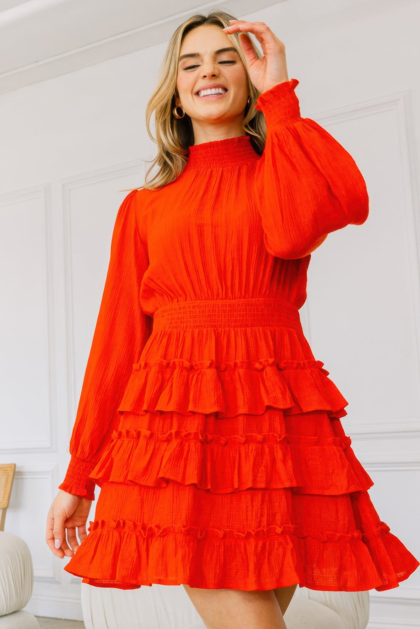 Toshe Women's Fashions smocked neck tiered ruffle mini dress with feminine details and tiered ruffle layers on the skirt.