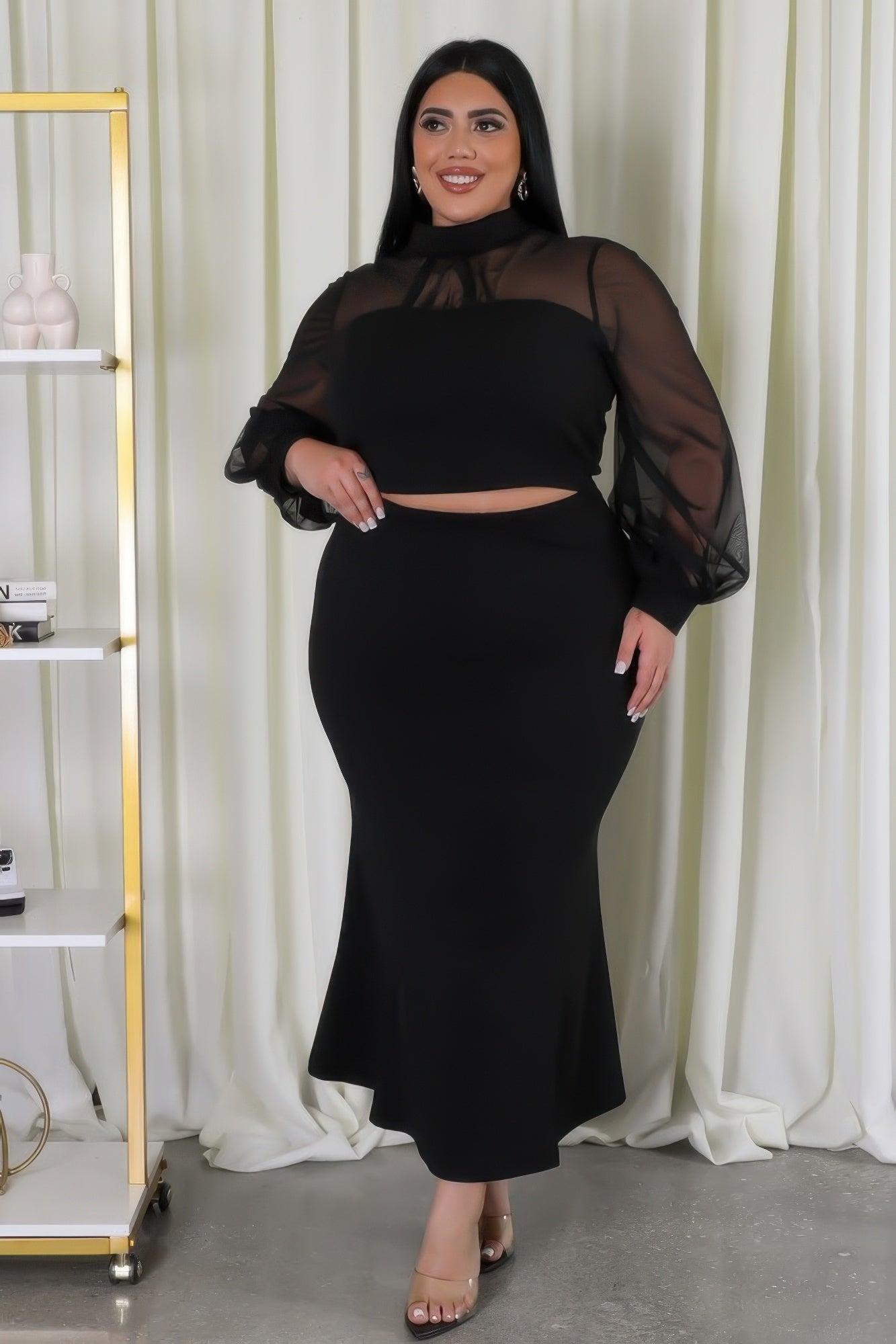 Sheer sleeve crop top and mermaid skirt set by Toshe Women's Fashions, featuring a fitted crop top with sheer sleeves and a flowing mermaid skirt.