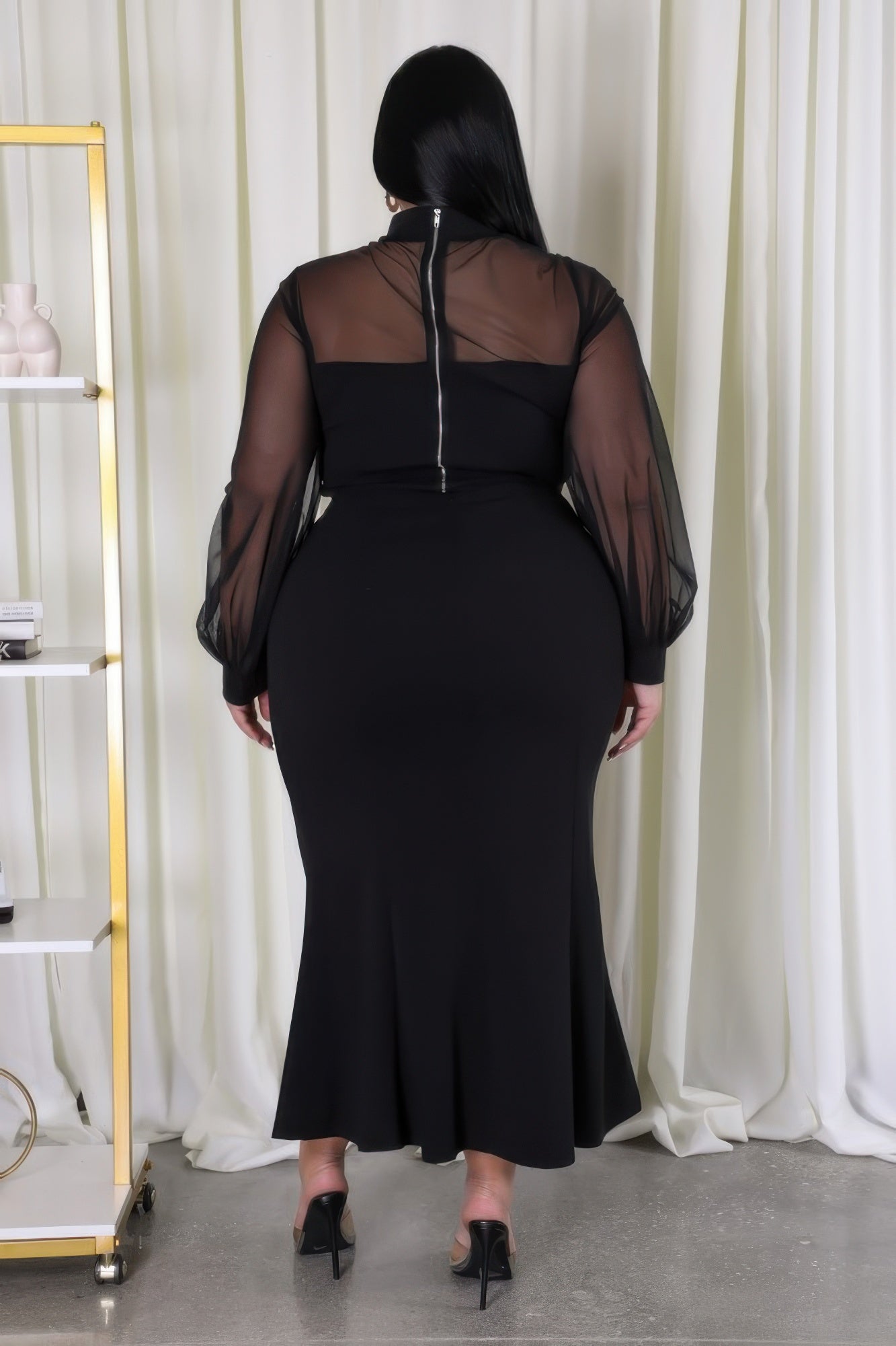 Sheer sleeve crop top and mermaid skirt set by Toshe Women's Fashions, shown in a stylish and fitted design.