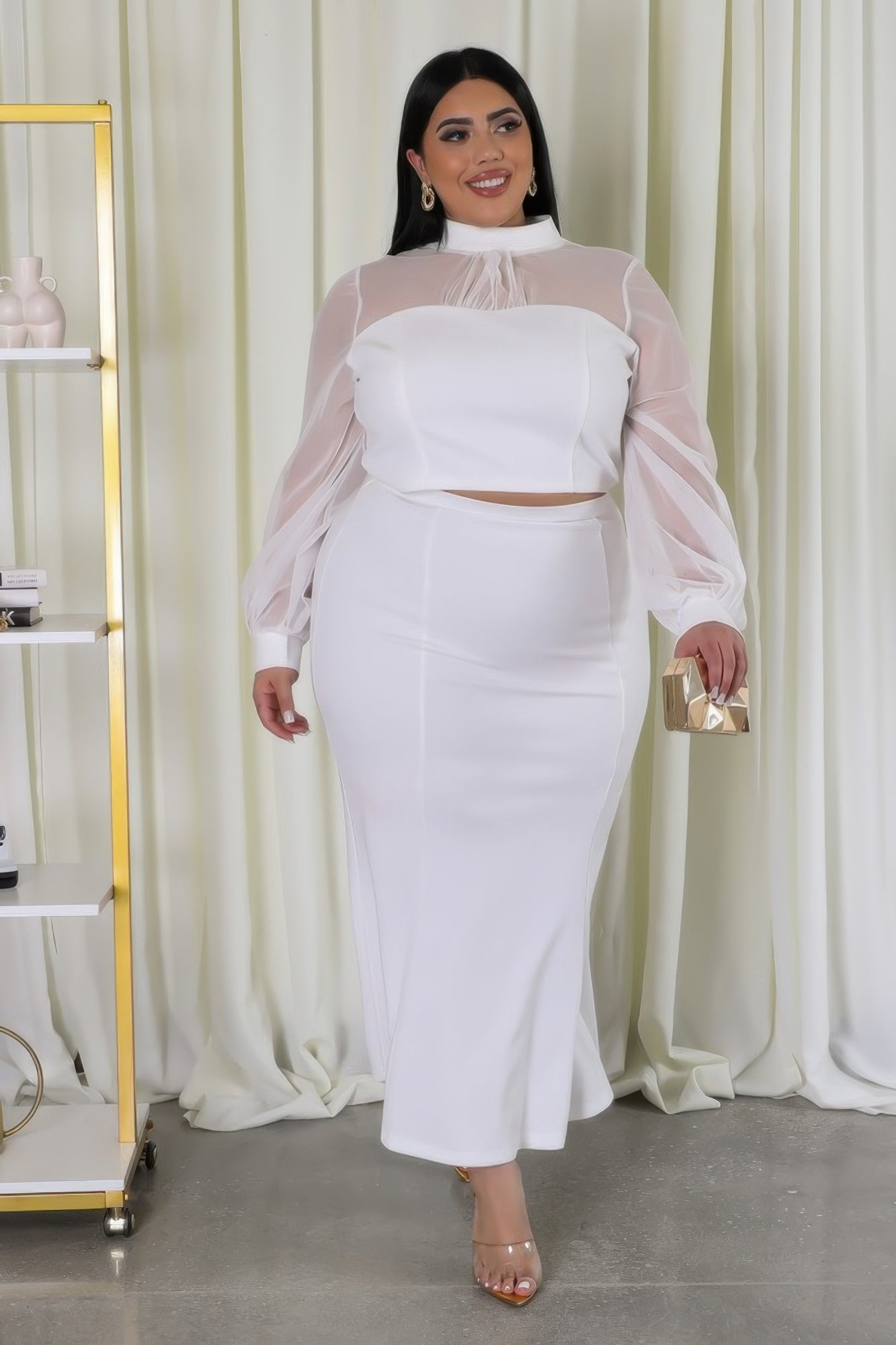 Sheer sleeve crop top and mermaid skirt set by Toshe Women's Fashions, shown in a stylish, coordinated outfit.