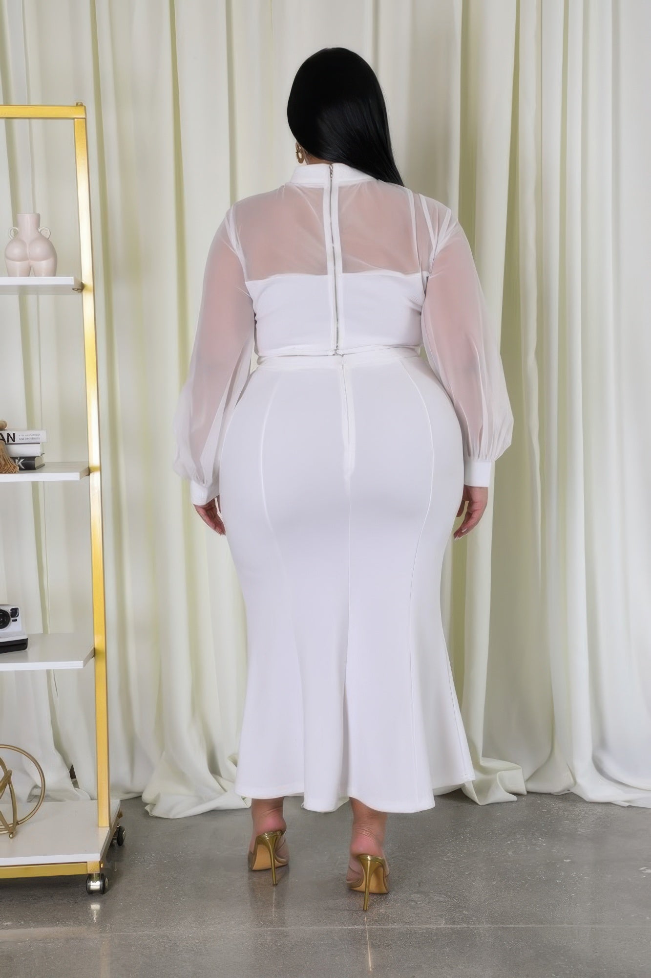 Sheer sleeve crop top and mermaid skirt set by Toshe Women's Fashions, featuring a stylish, fitted design with sheer fabric details.