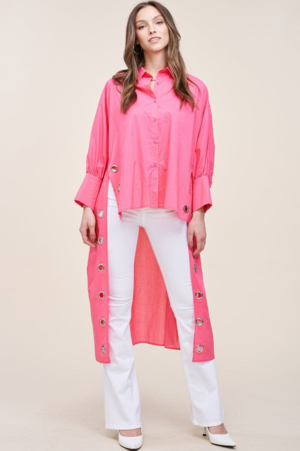 Oversized asymmetrical shirt by Toshe Women's Fashions featuring a flowy fit and unique hemline, shown in a stylish casual outfit.