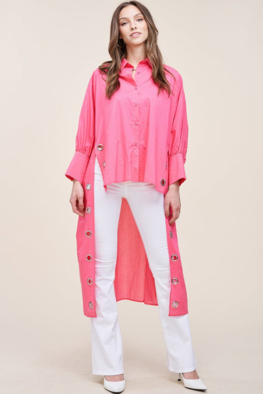 Oversized asymmetrical shirt by Toshe Women's Fashions featuring a flowy fit and unique hemline, shown in a stylish casual outfit.