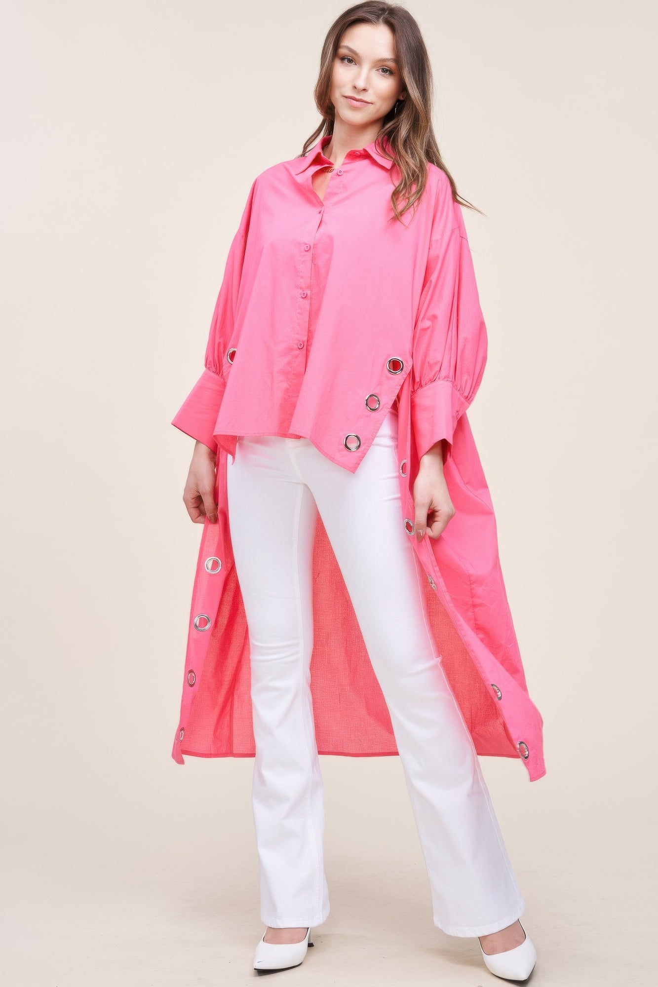 Oversized asymmetrical shirt by Toshe Women's Fashions, featuring a loose fit and unique hemline in soft fabric.