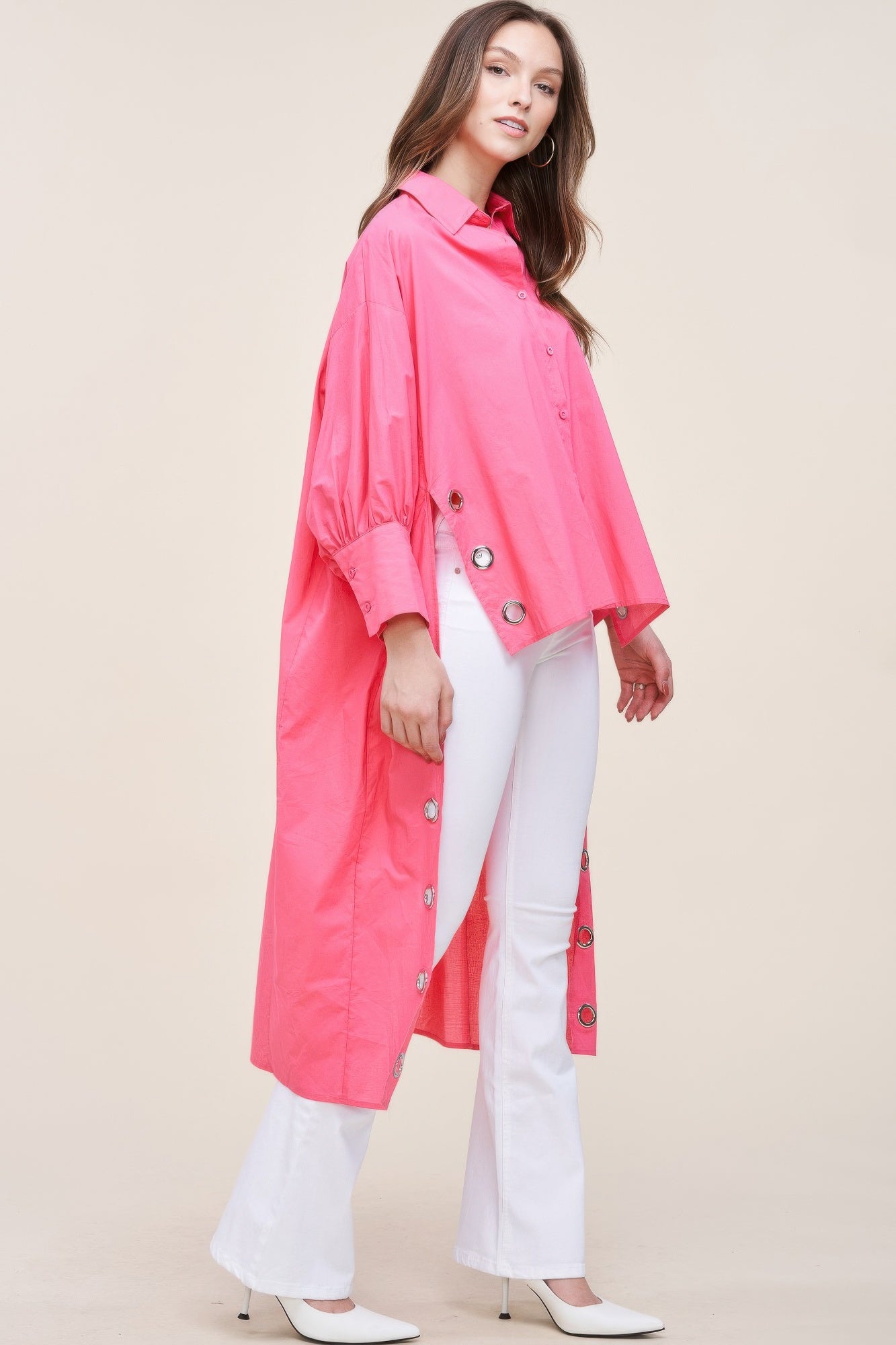 Oversized asymmetrical shirt from Toshe Women's Fashions featuring a flowing, modern design and unique hemline.