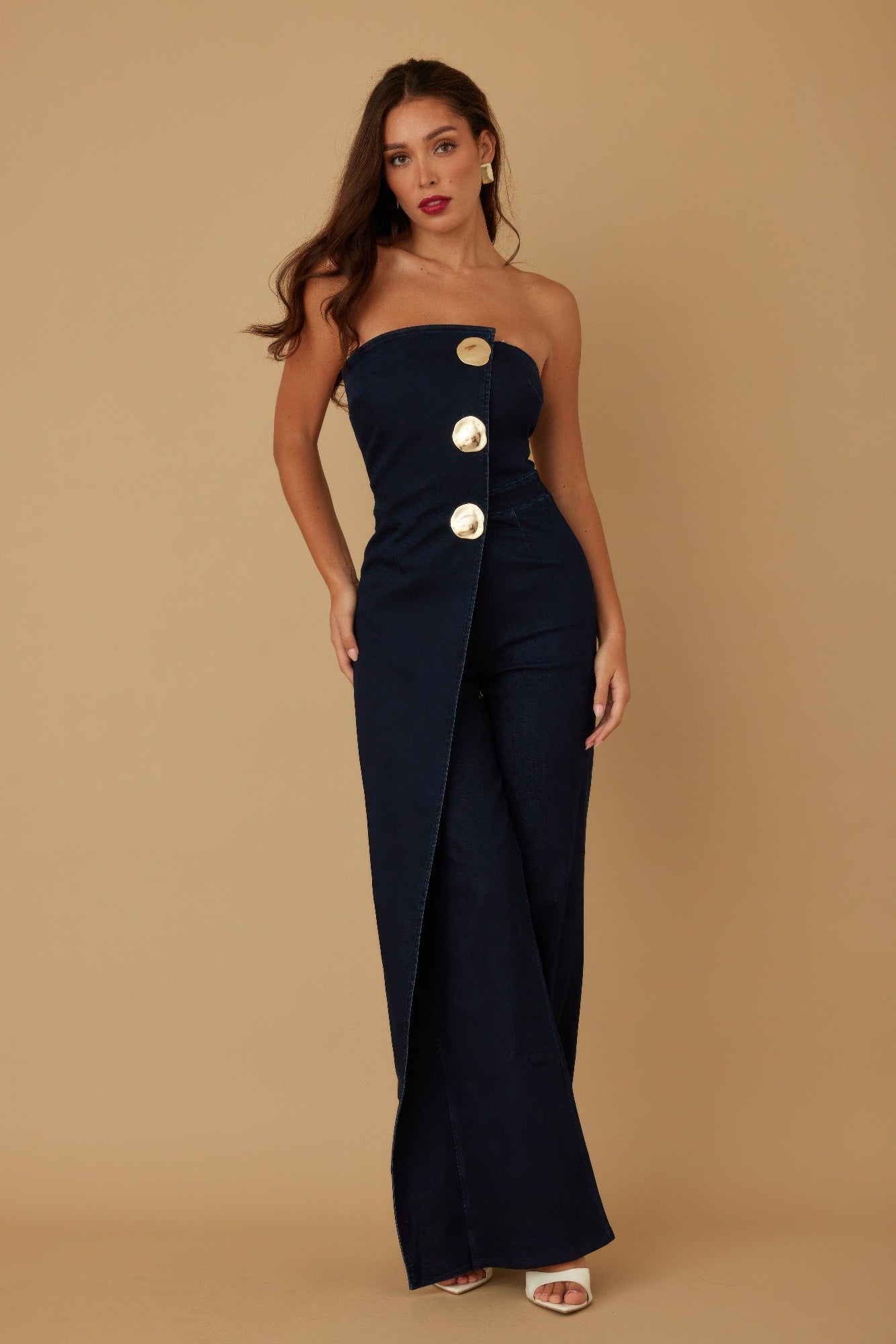 Toshe Women's Fashions open flap layer strapless jumpsuit with a fitted bodice and wide-leg pants, displayed on a model.