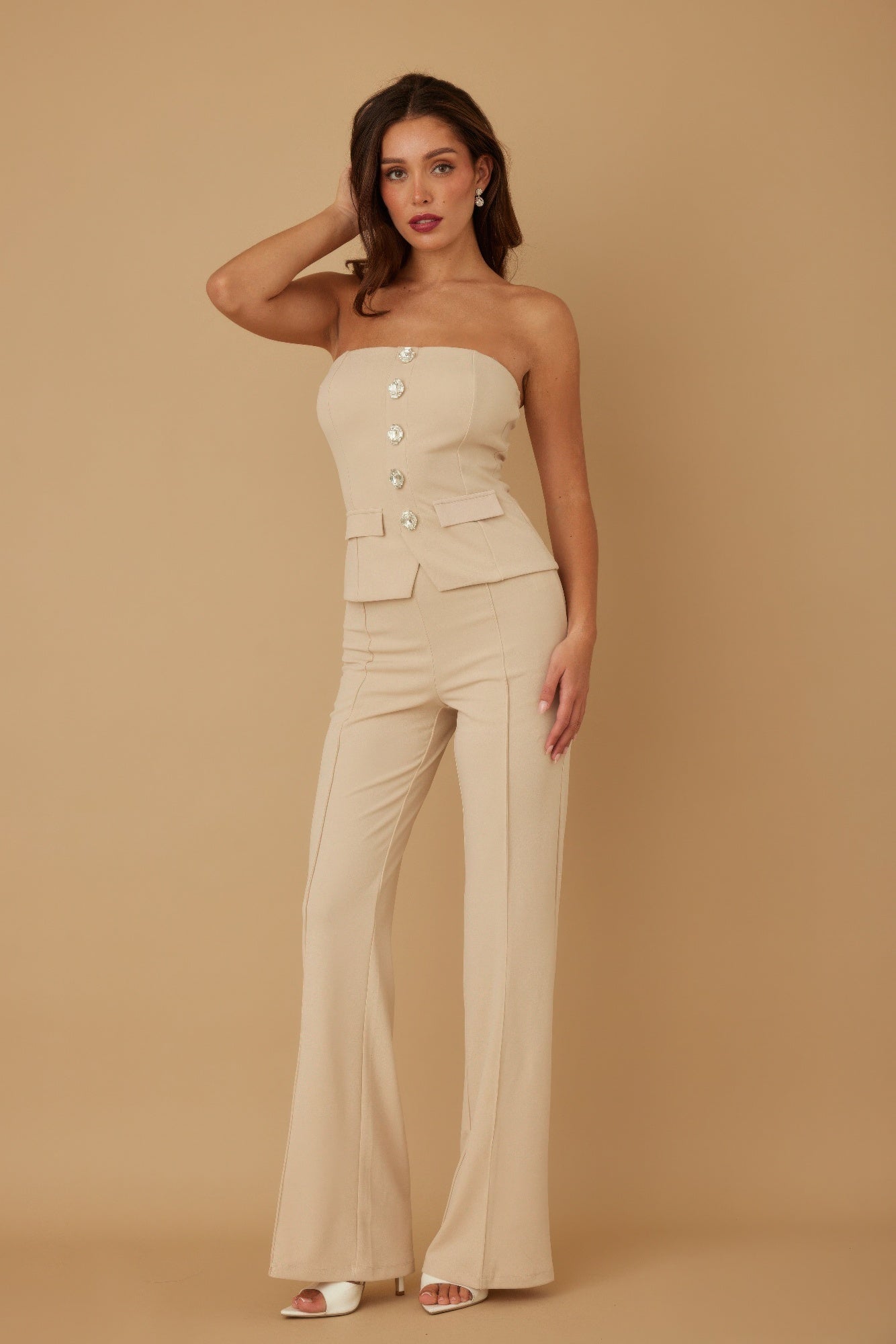 Buttoned tube top with oval crystal stone detail paired with matching pants from Toshe Women's Fashions.