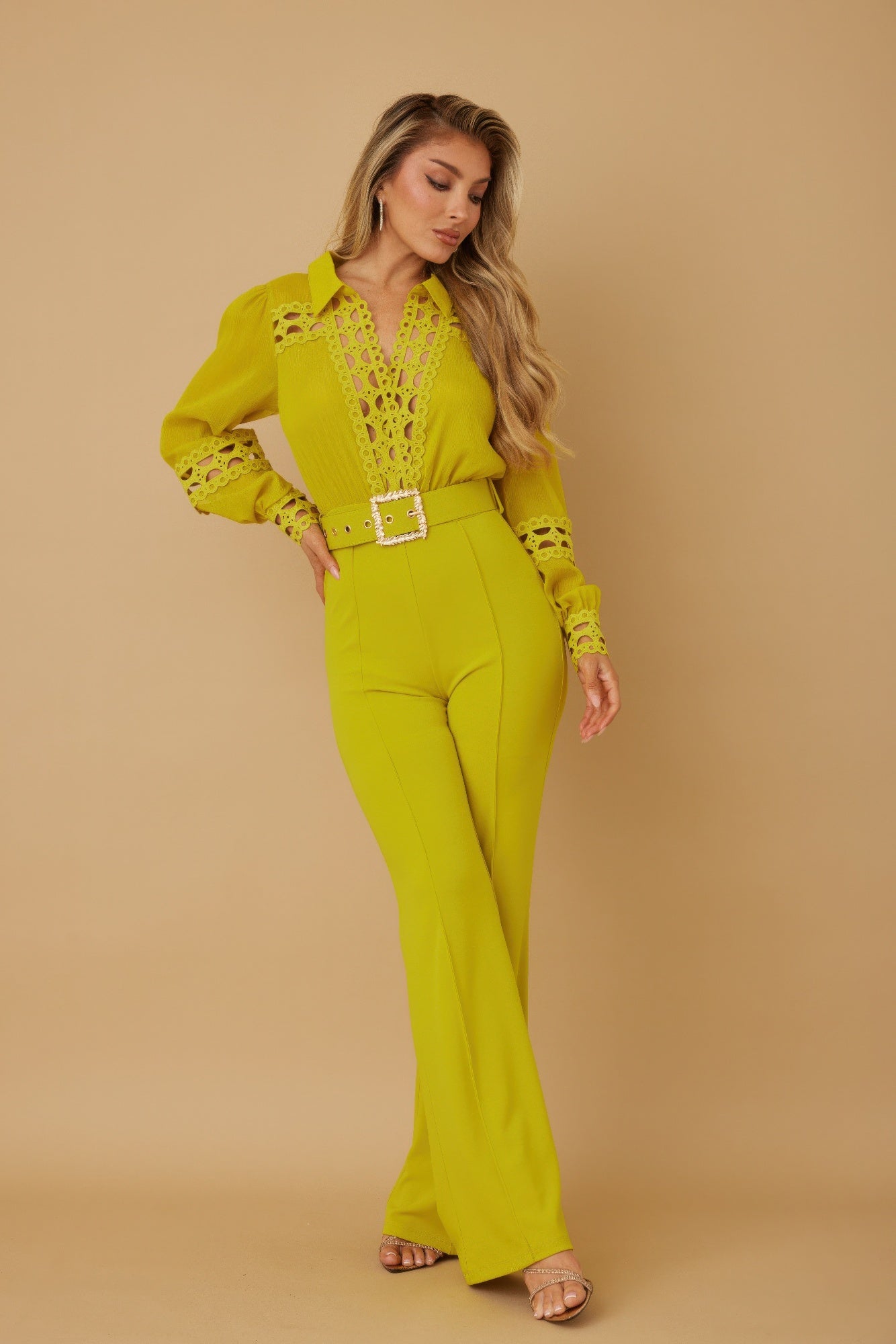 Crochet detailed woven jumpsuit by Toshe Women's Fashions, featuring intricate crochet patterns and a stylish fit.