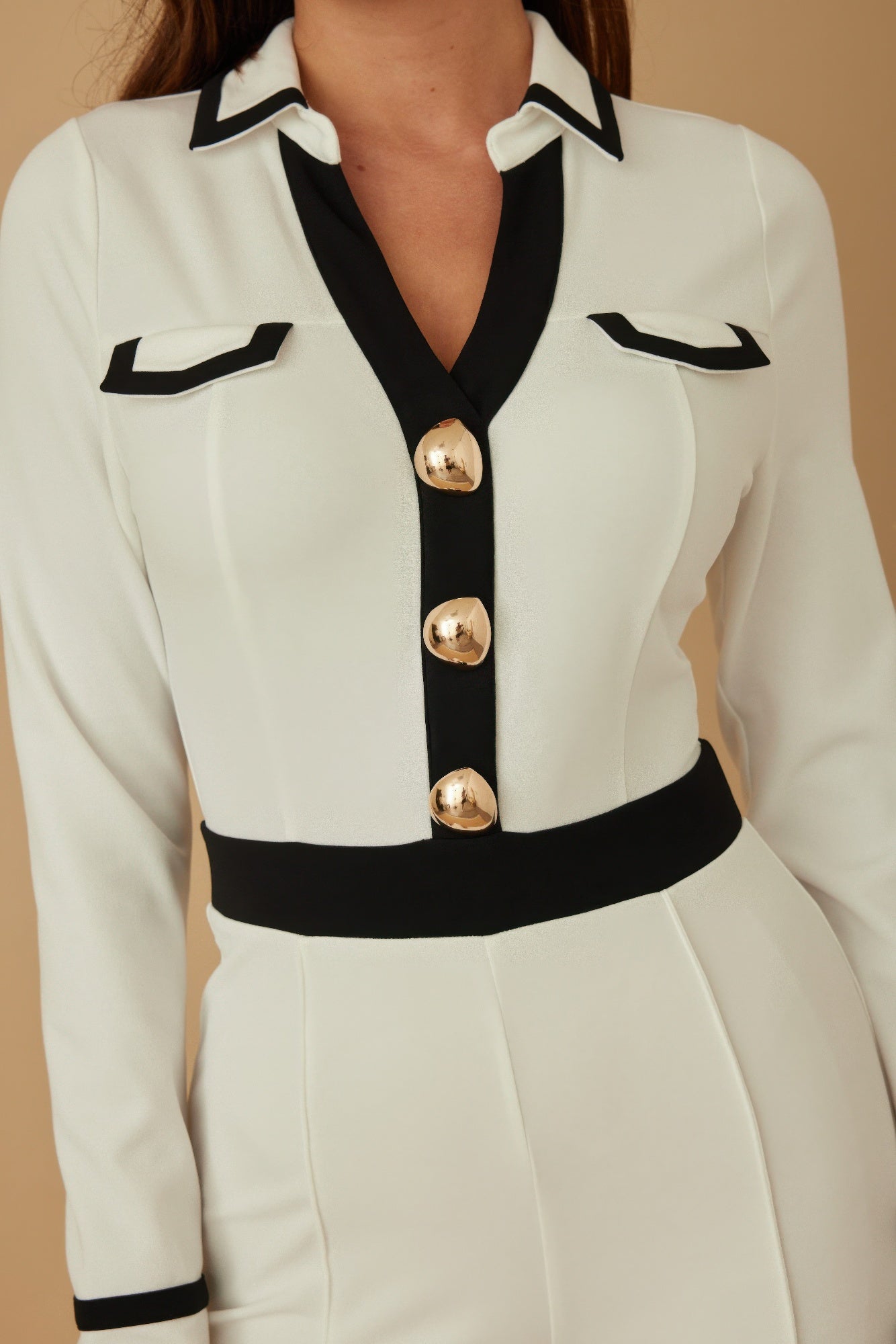 Toshe Women's Fashions Button Trio Jumpsuit featuring a stylish design, with three buttons at the front and a comfortable fit.