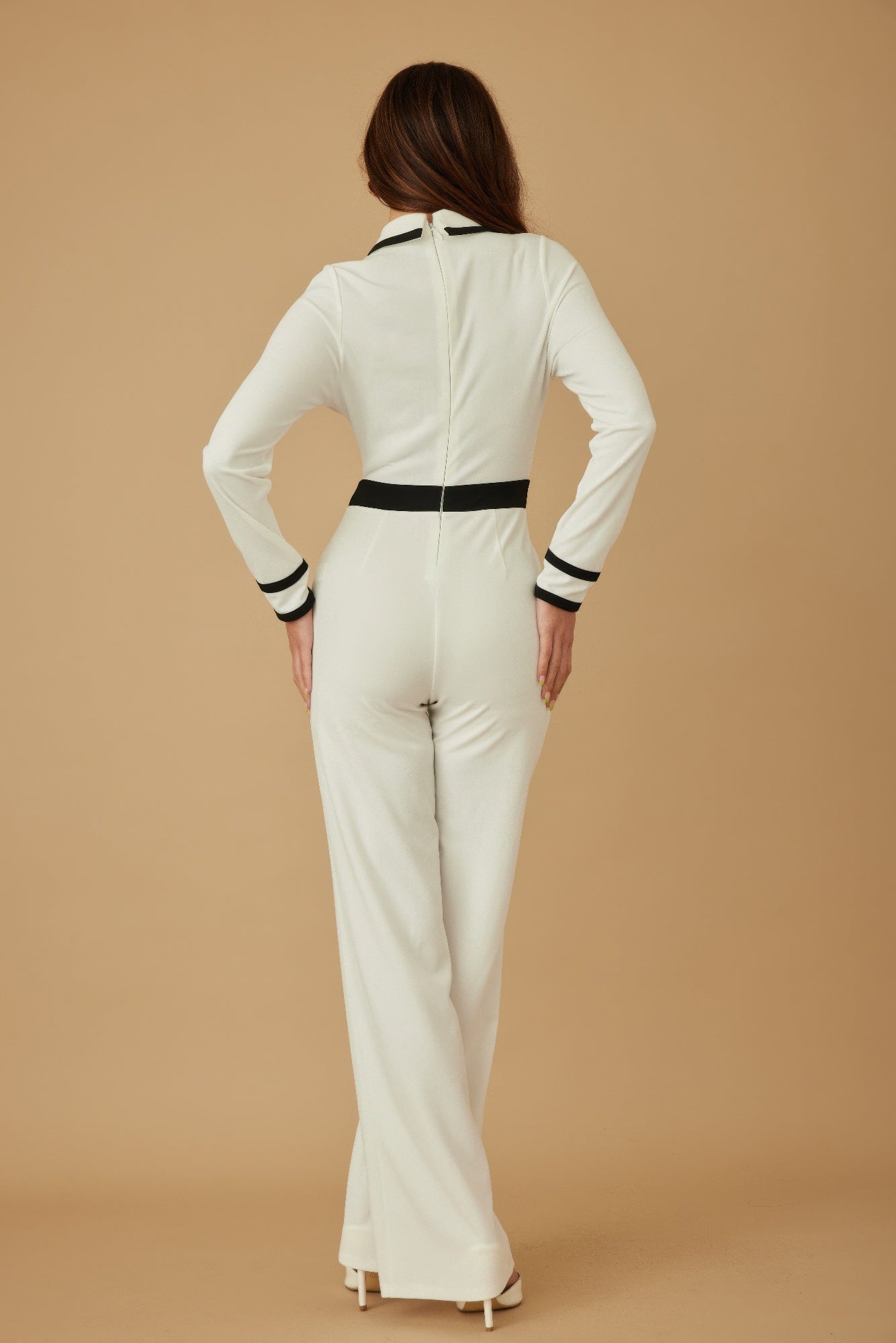 Toshe Women's Fashions Button Trio Jumpsuit displayed on a hanger, featuring a stylish, fitted design in a neutral color.
