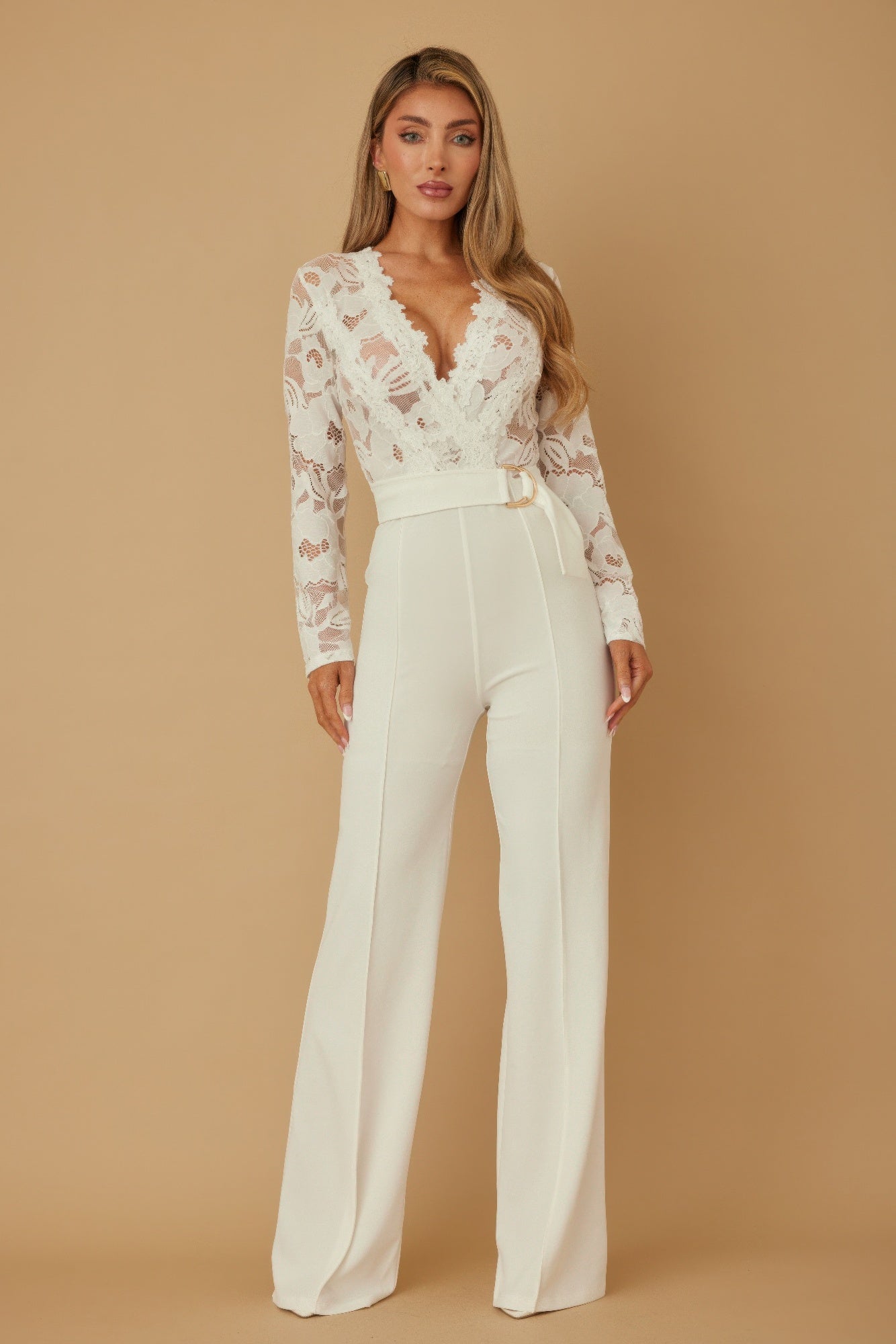 Lace crochet long sleeve jumpsuit by Toshe Women's Fashions featuring intricate lace details and a fitted silhouette.