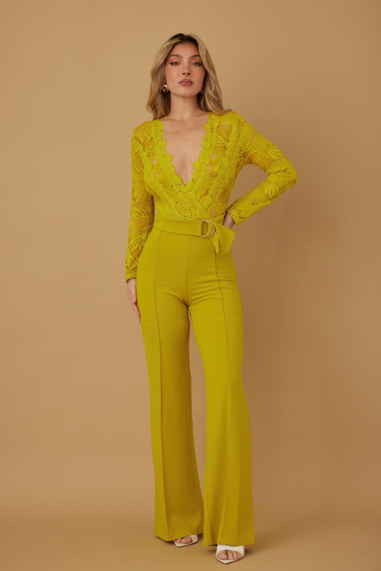 Lace crochet long sleeve jumpsuit by Toshe Women's Fashions, featuring intricate lace details and a fitted silhouette.