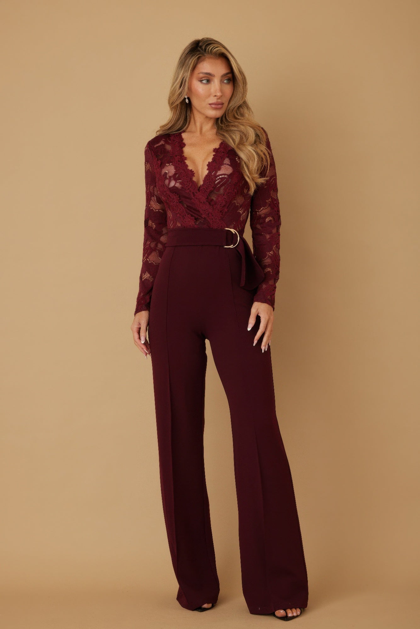 Lace crochet long sleeve jumpsuit by Toshe Women's Fashions, featuring intricate lace details and a fitted silhouette.