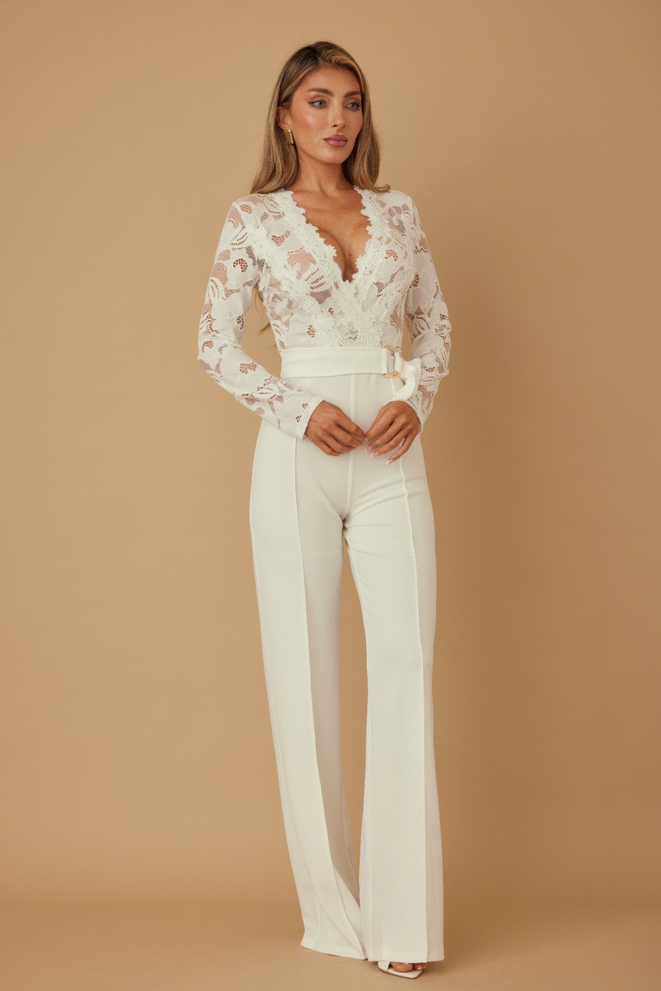 Lace crochet long sleeve jumpsuit by Toshe Women's Fashions featuring intricate patterns and a fitted silhouette.