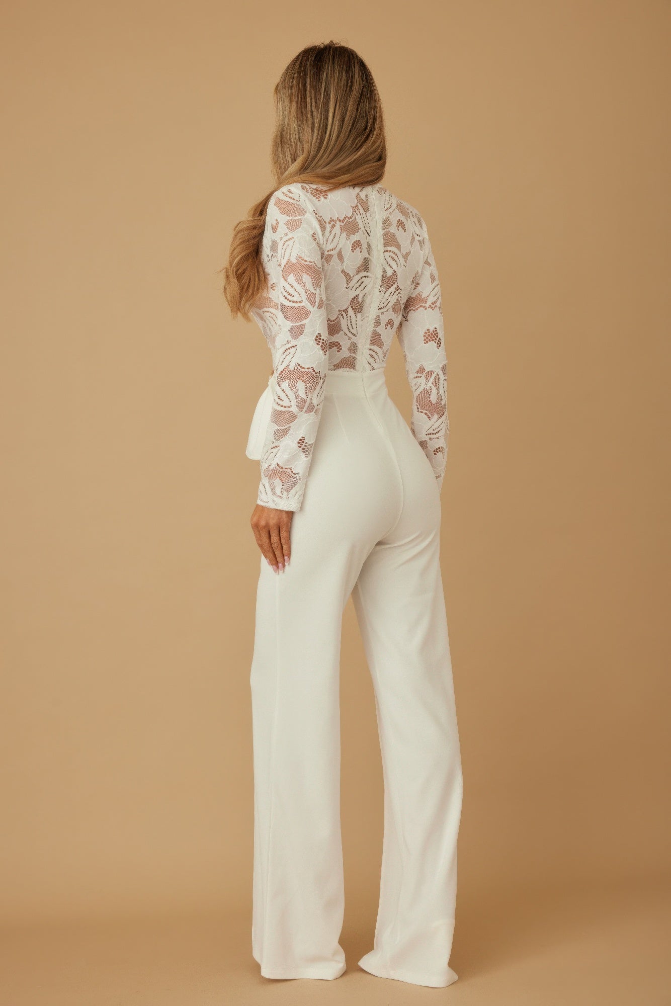 Lace crochet long sleeve jumpsuit by Toshe Women's Fashions, featuring intricate lace details and a fitted silhouette.