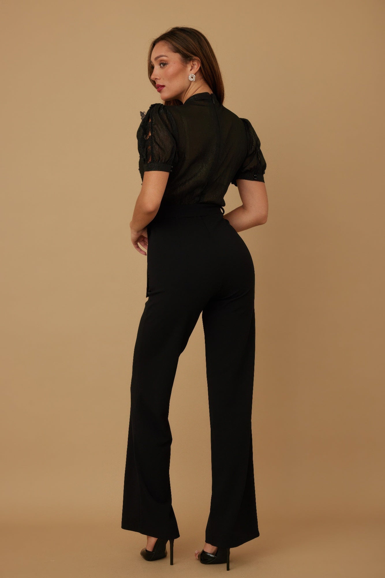 Elegant Toshe Women's Fashions butterfly sheer pattern jumpsuit with flowing fabric and vibrant butterfly design.