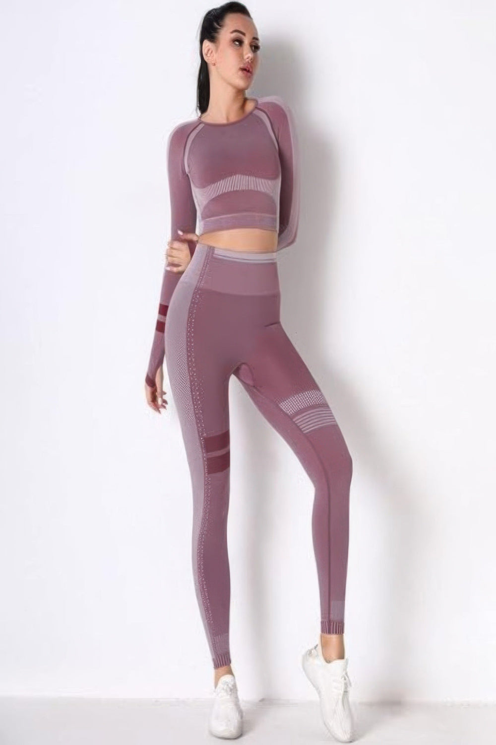 Toshe women's athleisure set featuring a seamless cropped top and matching pants, made from comfortable, stretchy fabric.