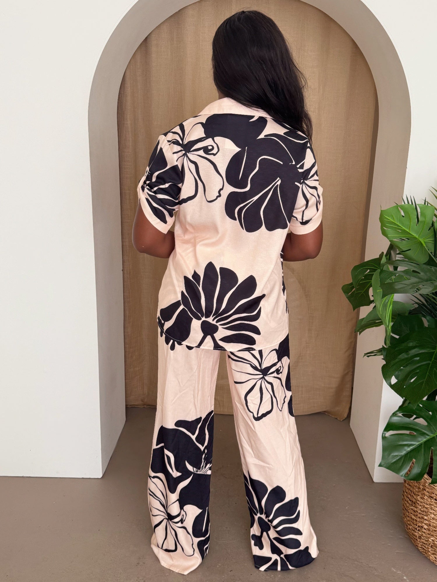 Black and beige floral bloom pants set for women, featuring a stylish matching top and wide-leg pants from Toshe Women's Fashions.