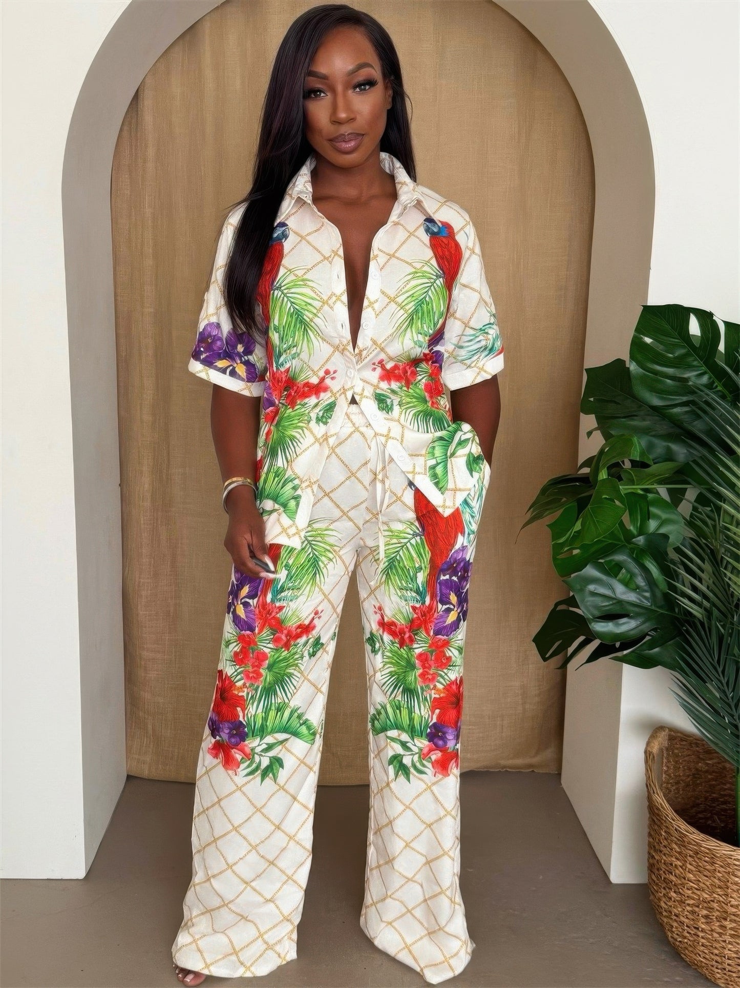 Toshe Women's Fashions tropical parrot print shirt and pant set, featuring vibrant bird and foliage designs.
