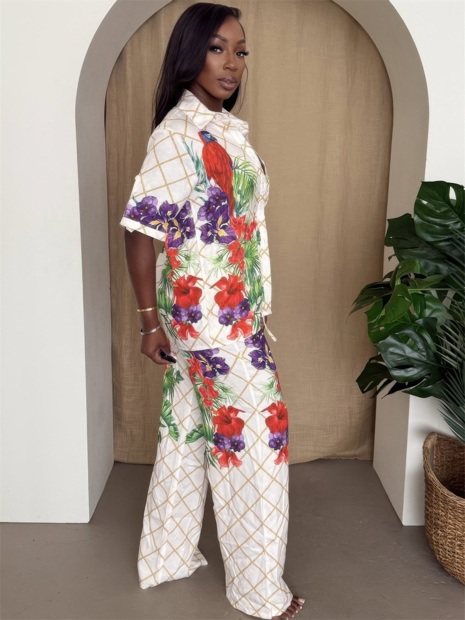 Tropical parrot print shirt and pant set for women by Toshe Women's Fashions, featuring vibrant bird and foliage patterns.