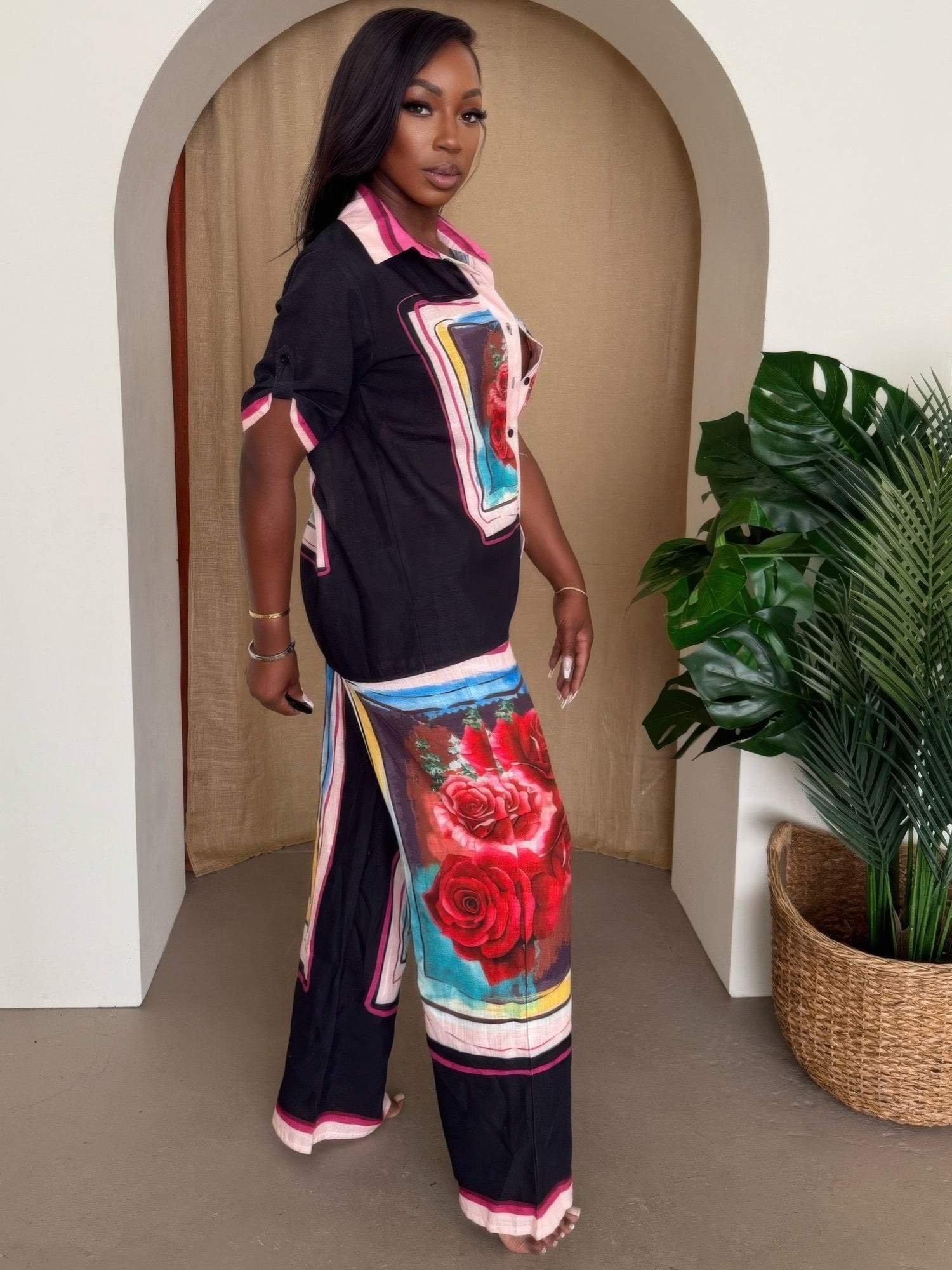 Midnight Bloom print resort pants set by Toshe Women's Fashions, featuring relaxed fit pants and matching top with vibrant floral design.