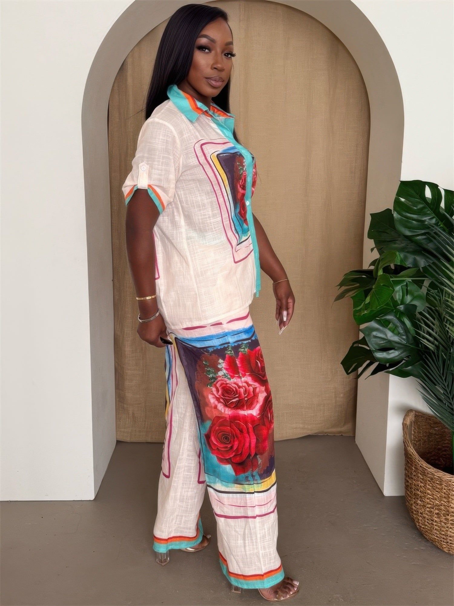 Floral print Toshe Women's Fashions button-up resort pants set featuring a matching top and wide-leg pants.