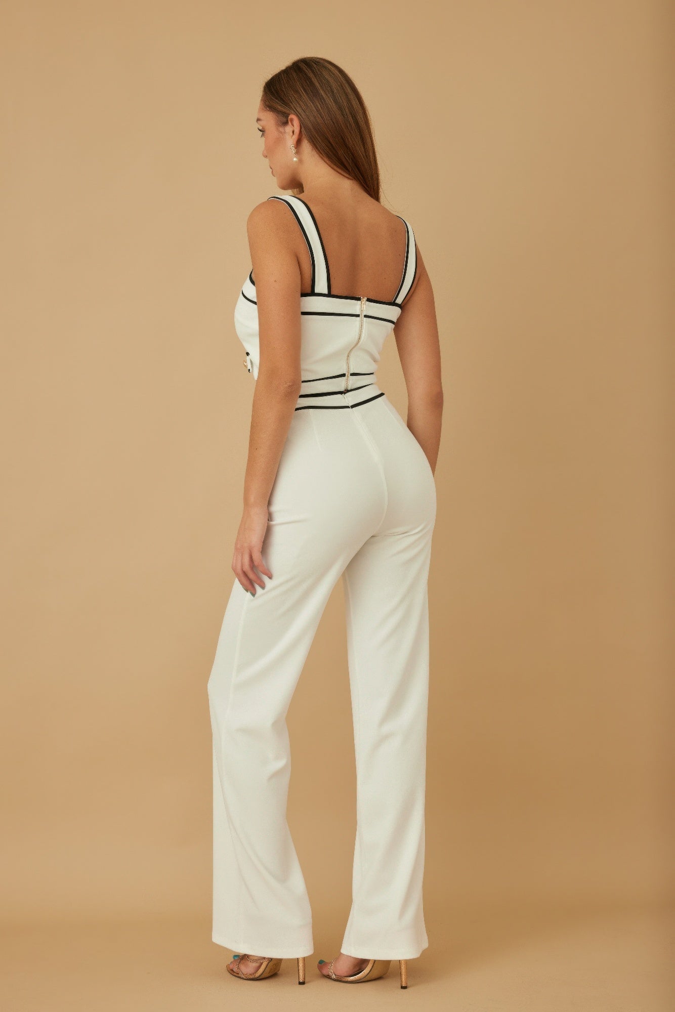 Black and white spaghetti crop top with contrast pants set by Toshe Women's Fashions, shown on a model.