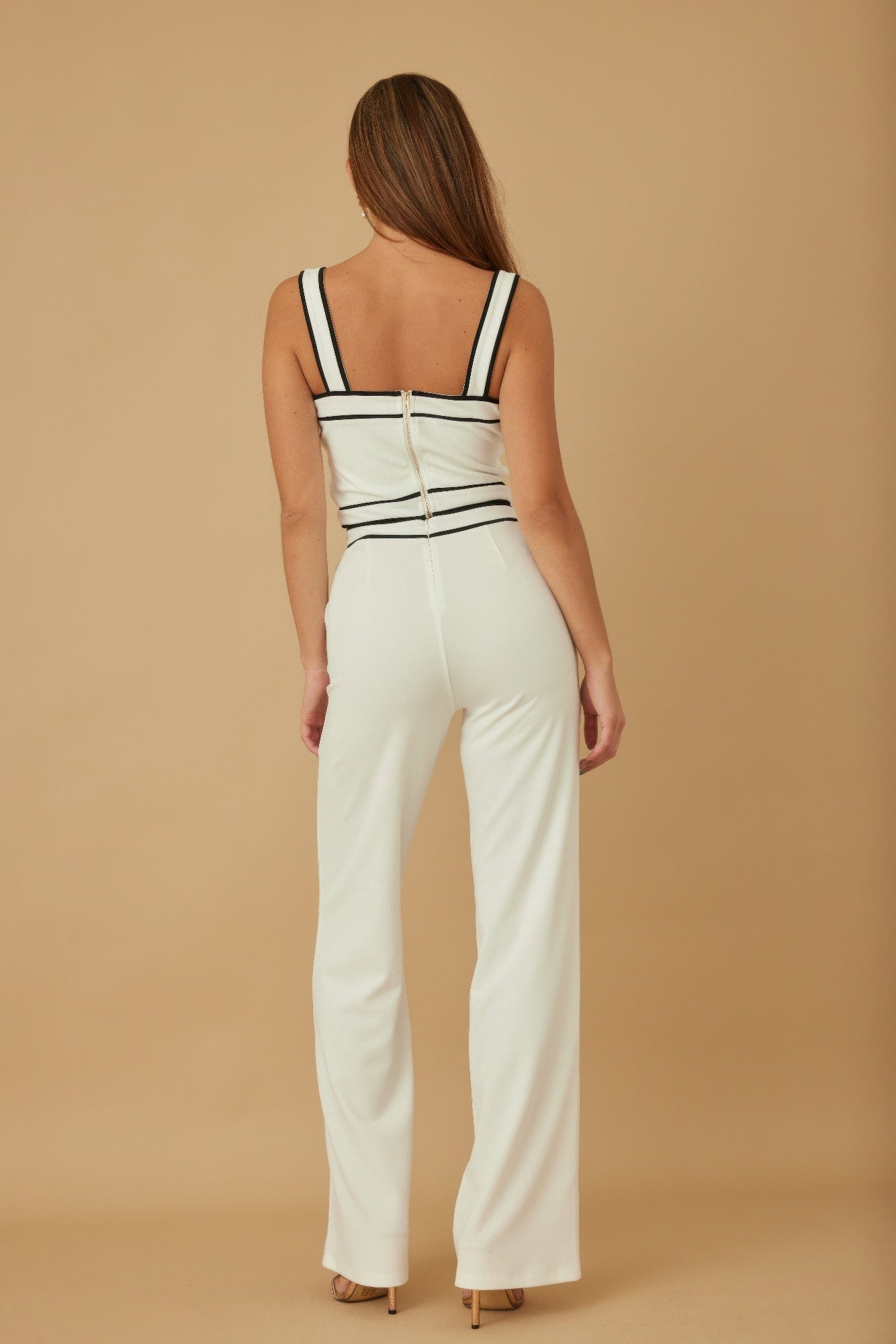 Black and white spaghetti crop top with contrast pants set by Toshe Women's Fashions, shown on a model.