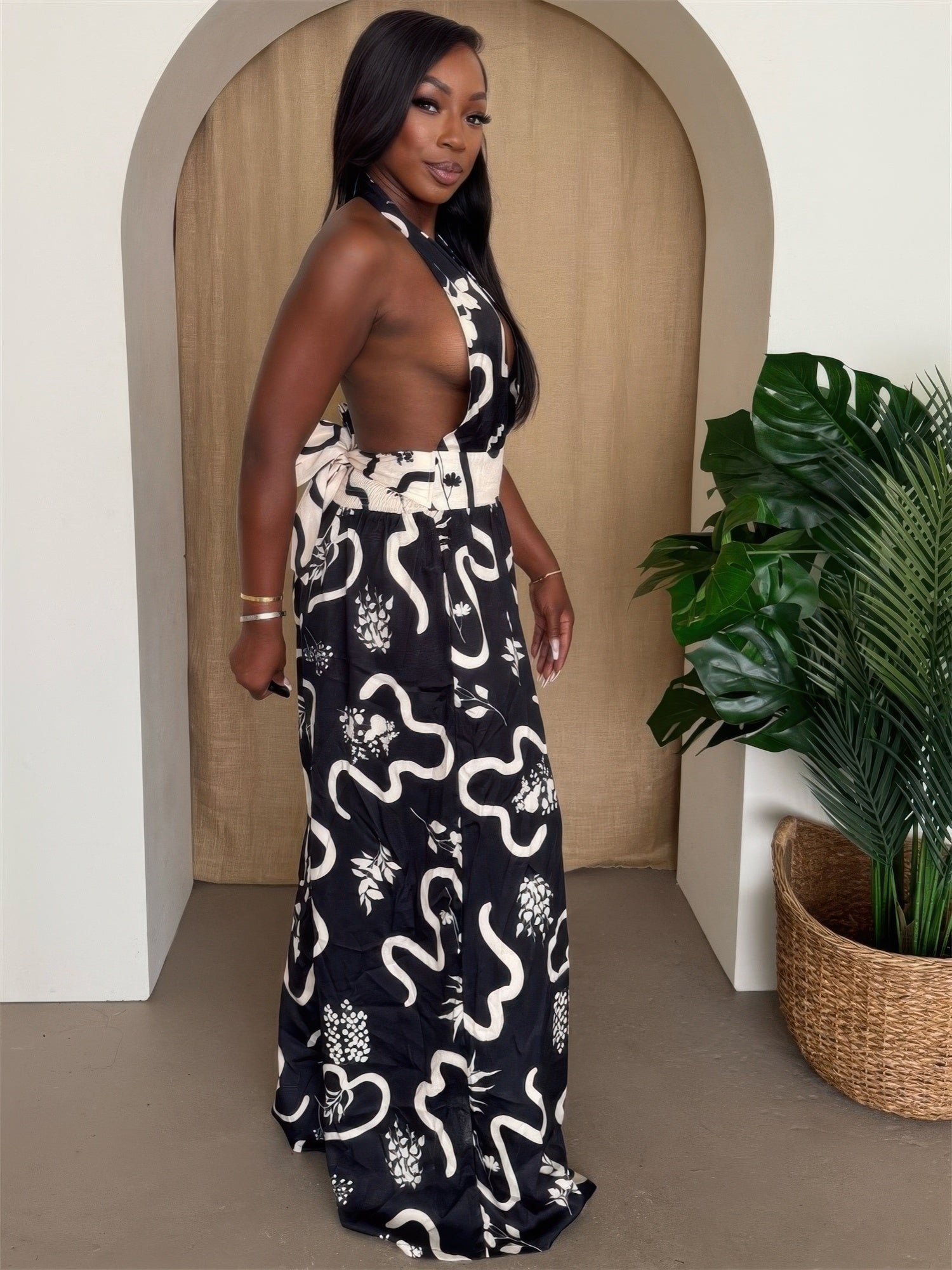 Botanic Maze halter wide-leg jumpsuit by Toshe Women's Fashions, featuring a floral pattern and relaxed fit.