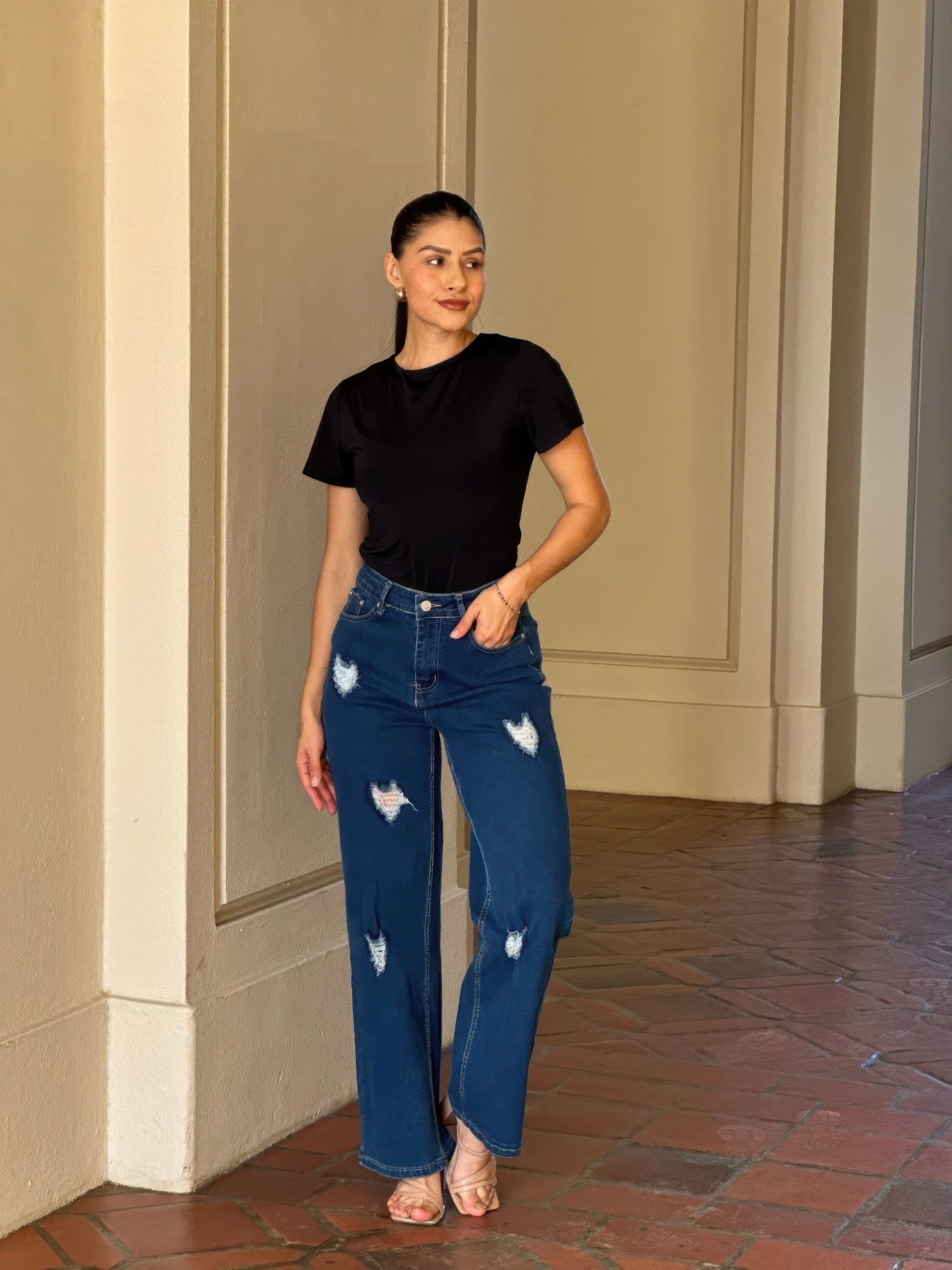 Distressed wide-leg denim jeans with embroidered heart design by Toshe Women's Fashions, shown with a relaxed fit and stylish details.