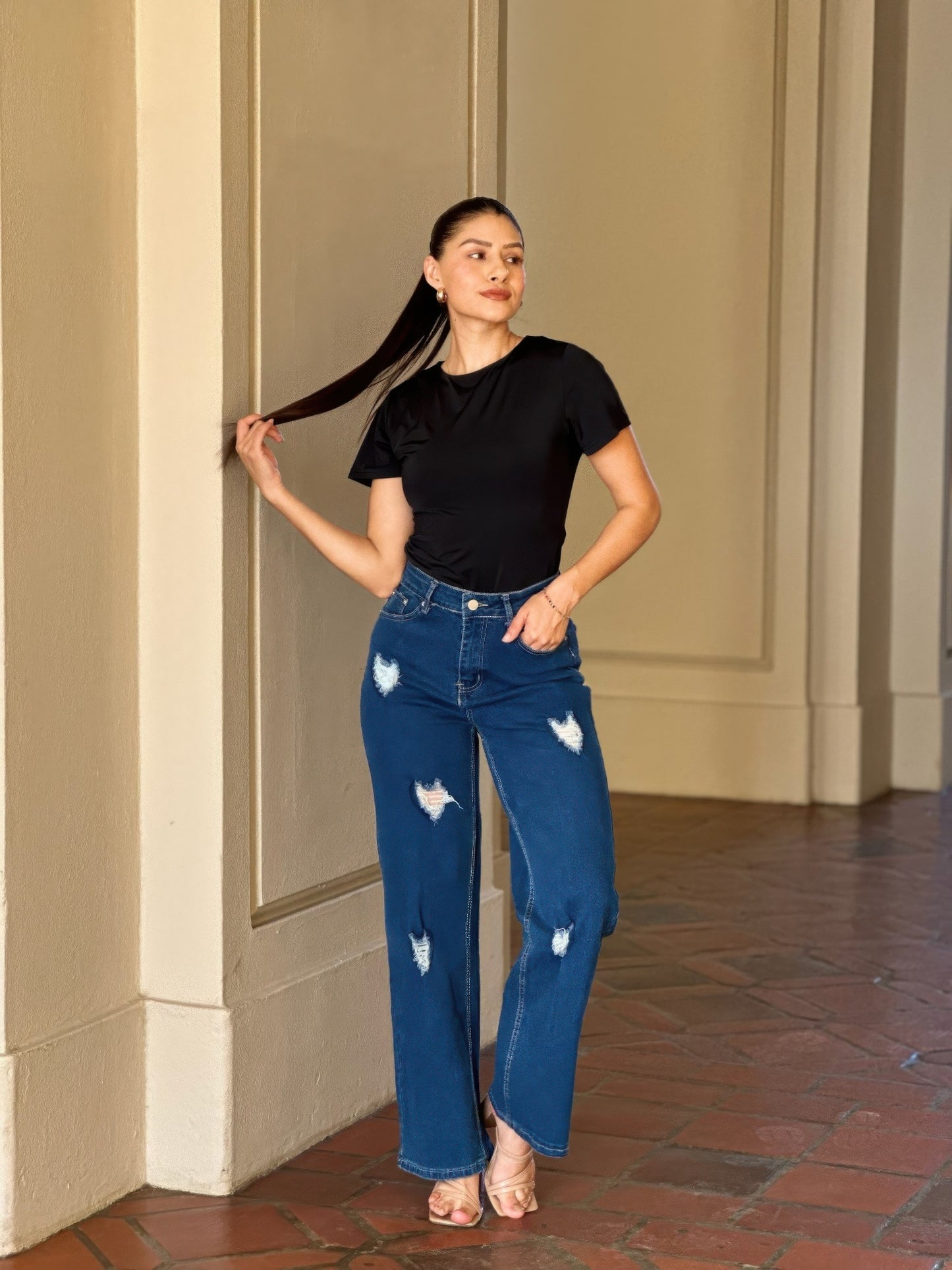 Distressed wide-leg denim jeans with embroidered heart design, Toshe Women's Fashions, front view showing stylish details.