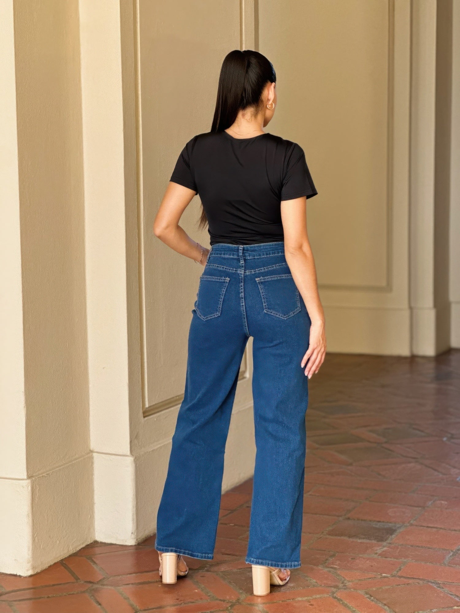 Distressed wide-leg denim jeans with embroidered heart design by Toshe Women's Fashions, showcasing the stylish back view.