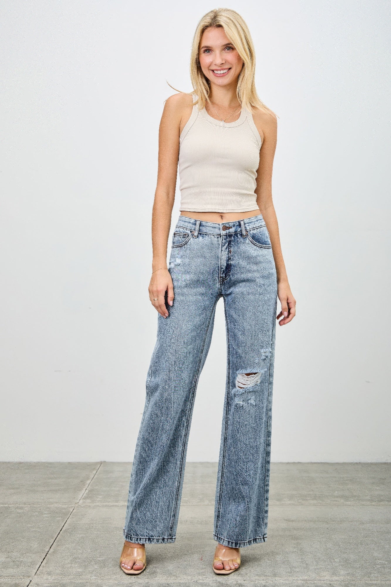 Toshe Women's Fashions mid-rise relaxed straight jeans with distressed hem, denim fabric, and casual fit.